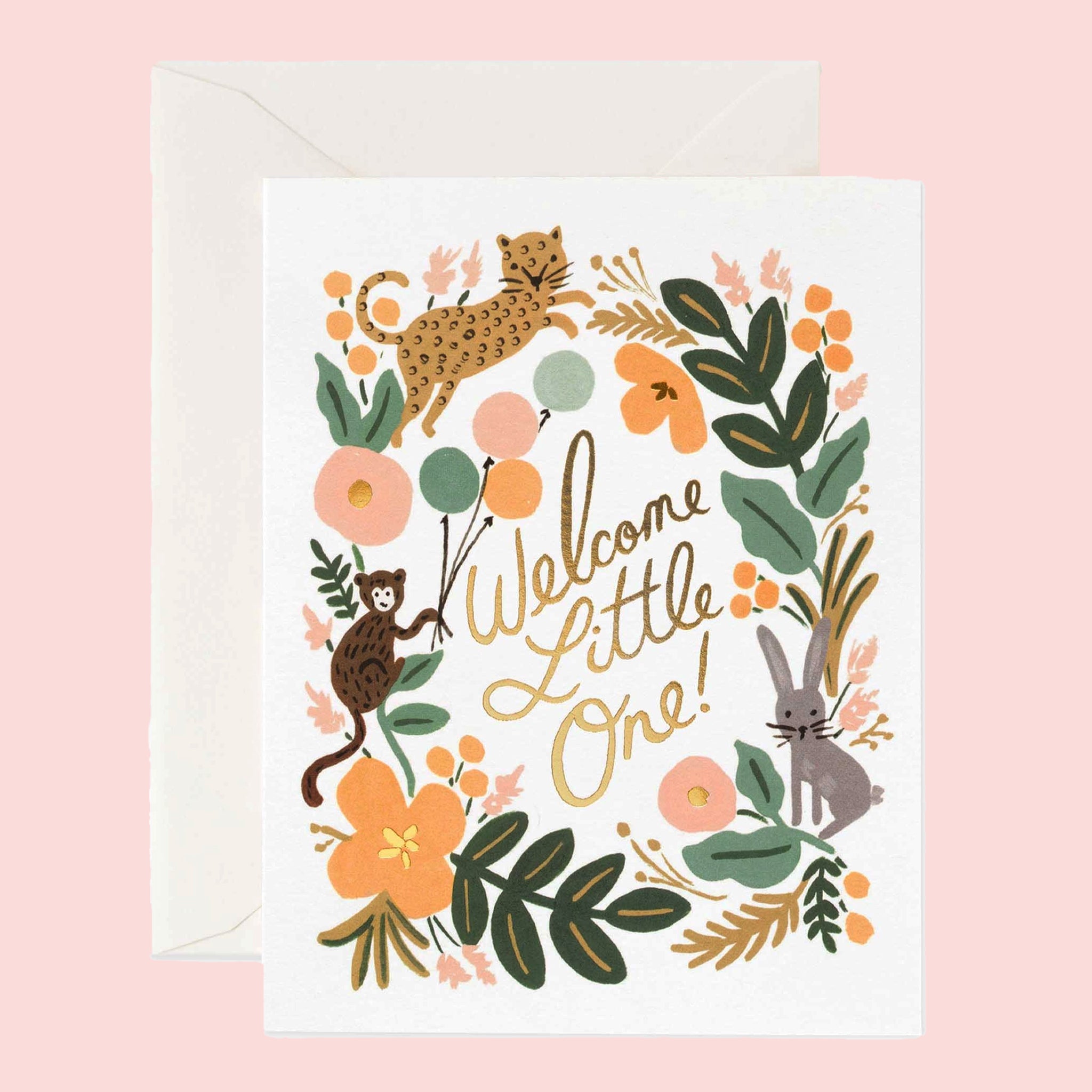 On a pink background is a white envelope with multi colored jungle border and gold foiled text in the center that reads, "Welcome Little One". 