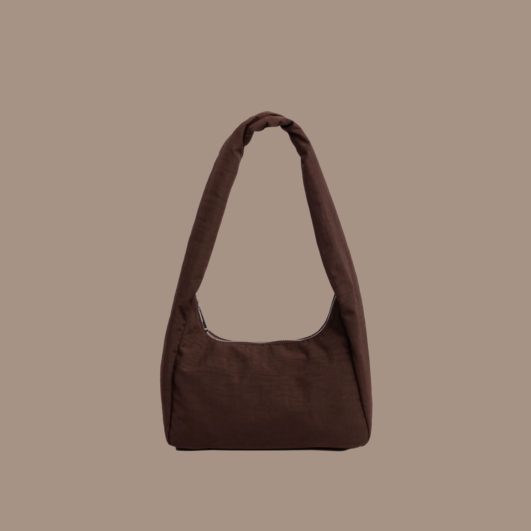 Brown reusable nylon tote with zipper on a brown background. 