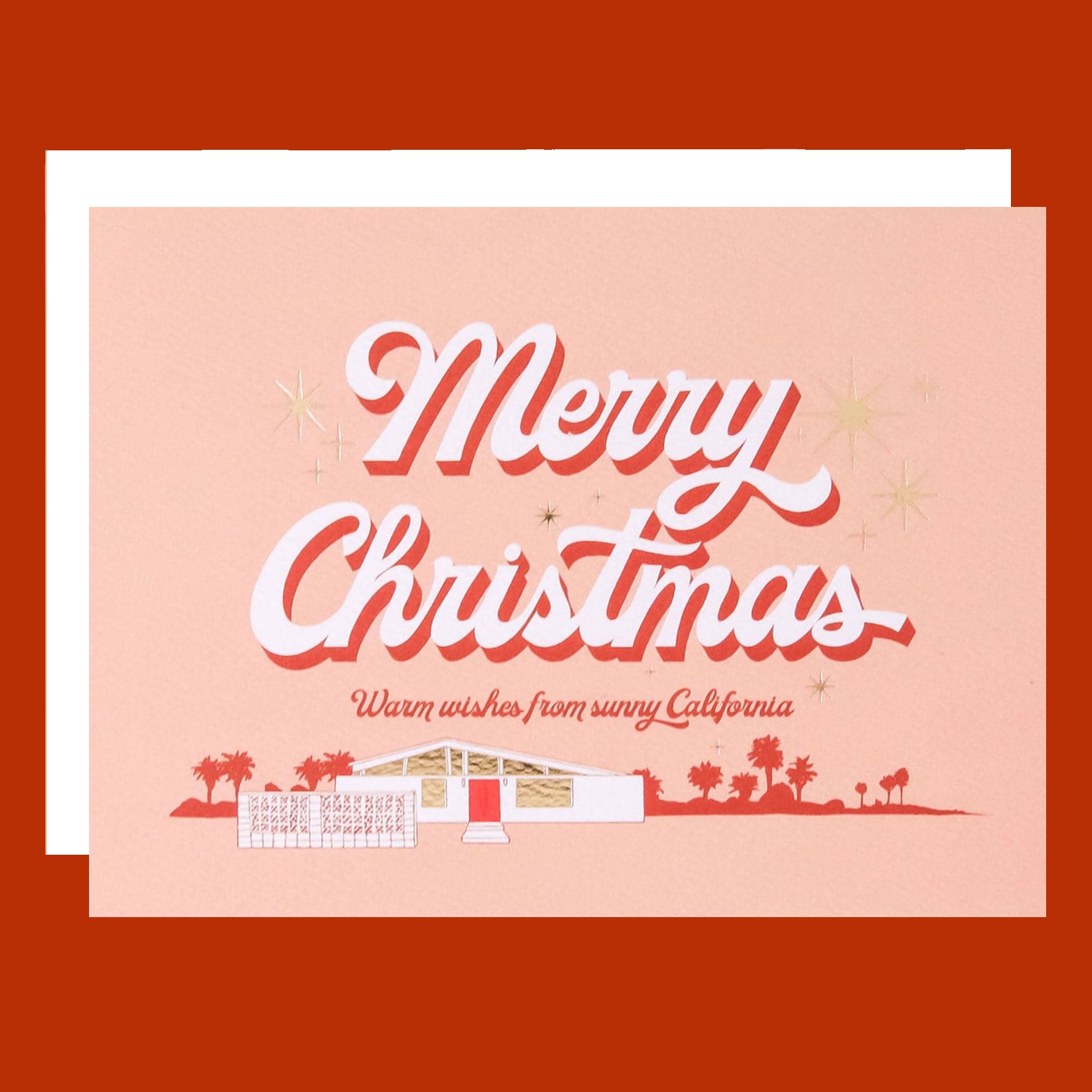 A peachy card with a graphic of a midcentury home and text that reads, 'Merry Christmas Warm wishes from sunny California'. 