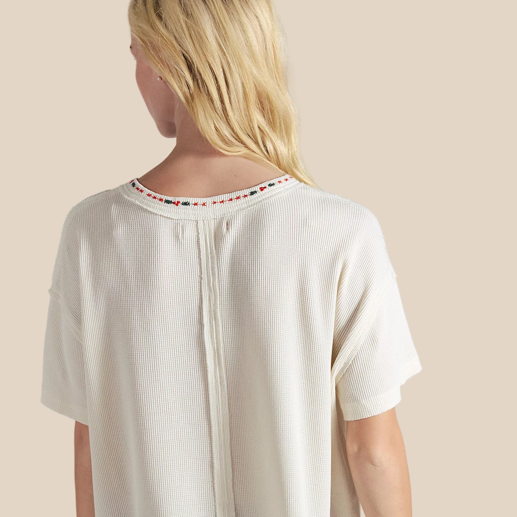 A ribbed relaxed fit t-shirt with a graphic of a dachshund next to a Christmas tree.  