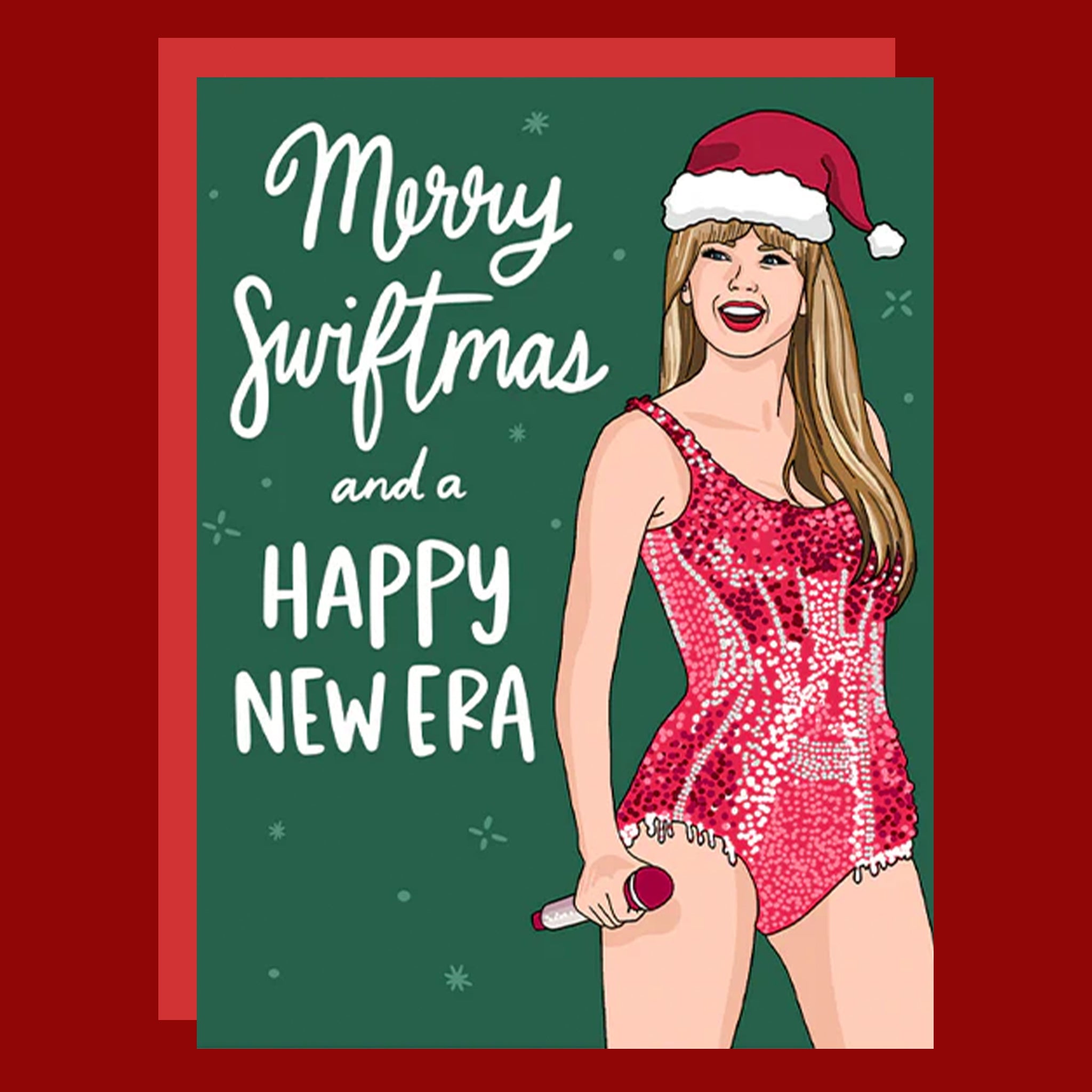Holiday greeting card with Taylor Swift in a red santa and red bodysuit. The card reads "Merry Swiftmas and a Happy New Era".