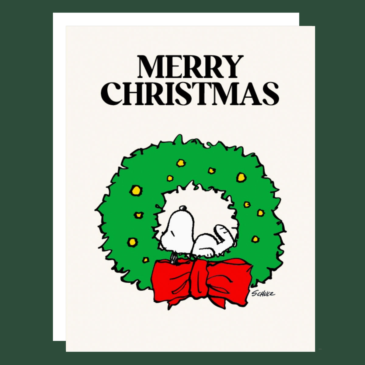 A Christmas greeting card featuring the text 'MERRY CHRISTMAS' above a cartoon Snoopy inside a green wreath with yellow lights and a red bow, shown against a dark green background.