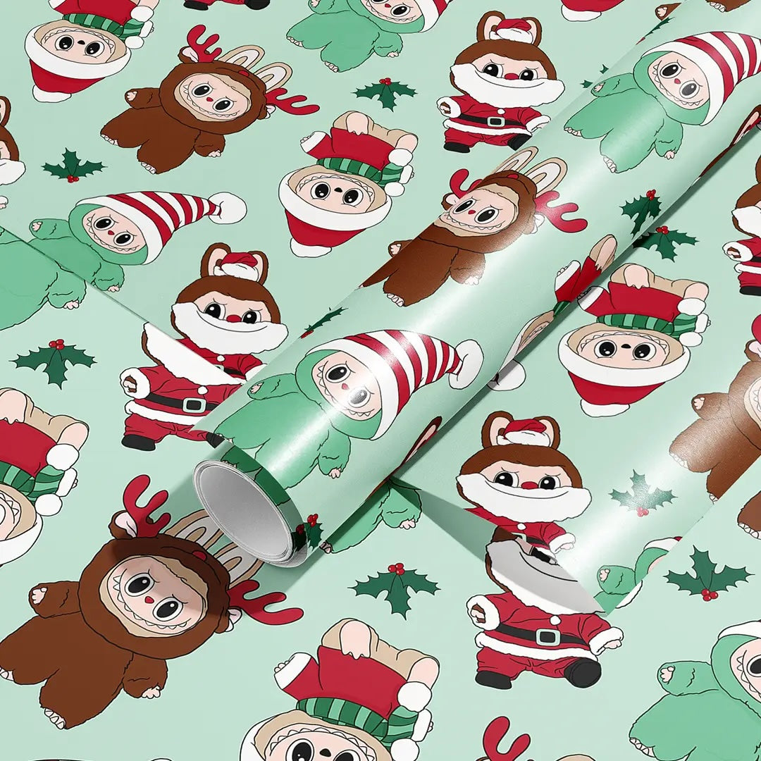 Rolls of mint-green holiday wrapping paper covered in cute cartoon characters in Christmas outfits—Santa suits, elf hats, and reindeer costumes—with small holly sprigs scattered throughout.