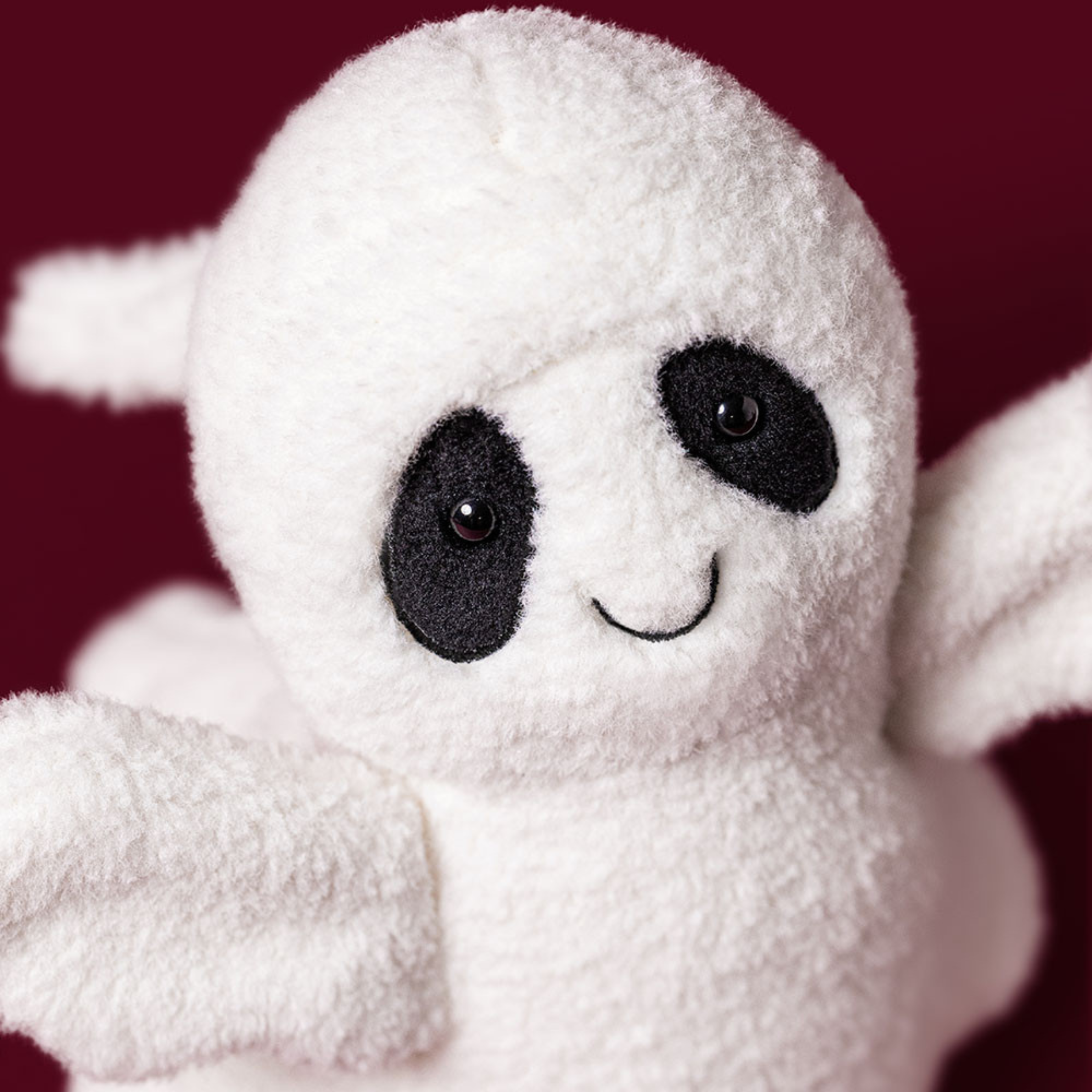 a ghost shaped plush toy