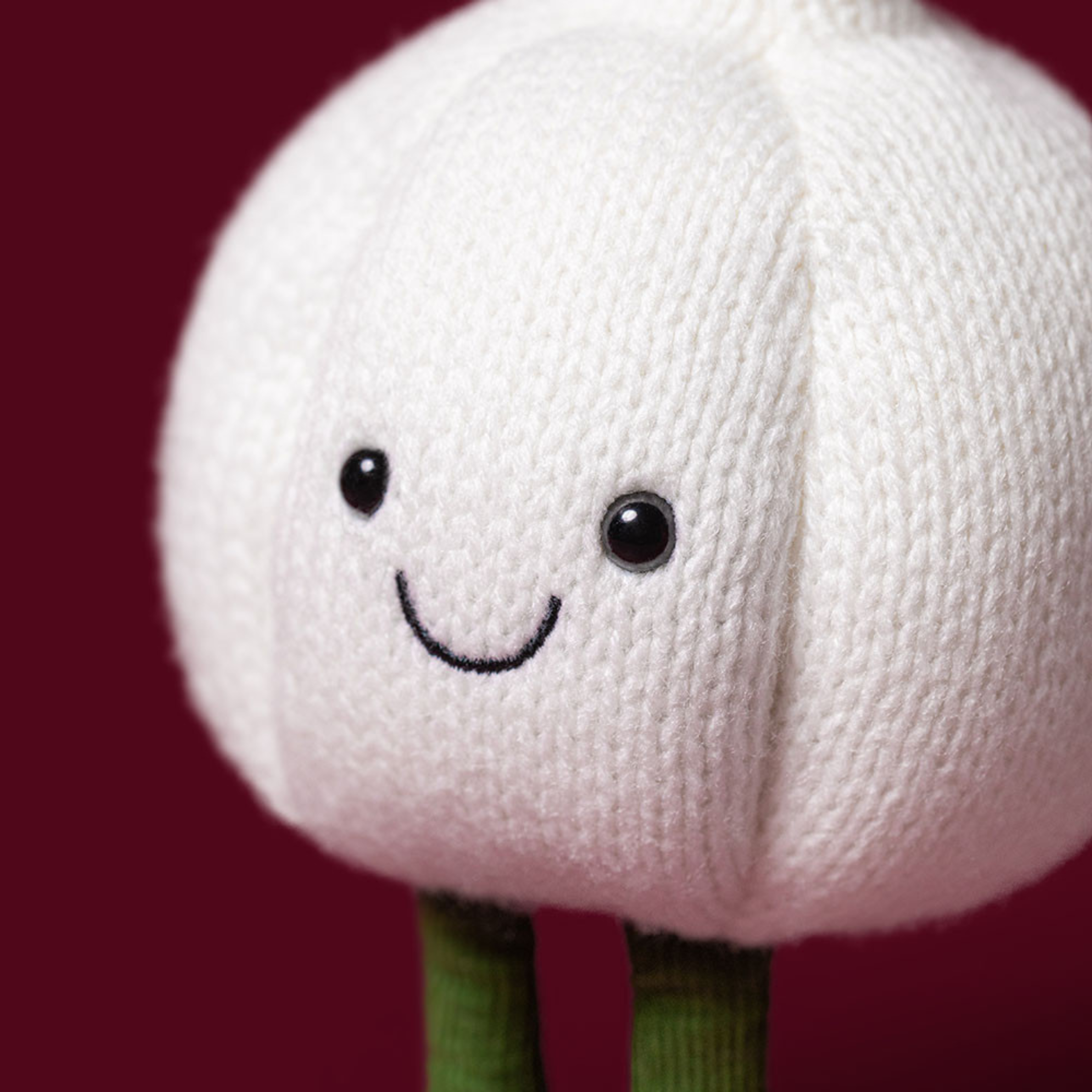 a garlic shaped plush toy.