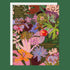 A square floral greeting card with a white envelope behind it, featuring a dense botanical illustration in pink, purple, green, orange, and gold text that reads 'SERVING MAIN CHARACTER ENERGY ALL YEAR.' and 'HAPPY BIRTHDAY LOVELY!' on a dark green background.