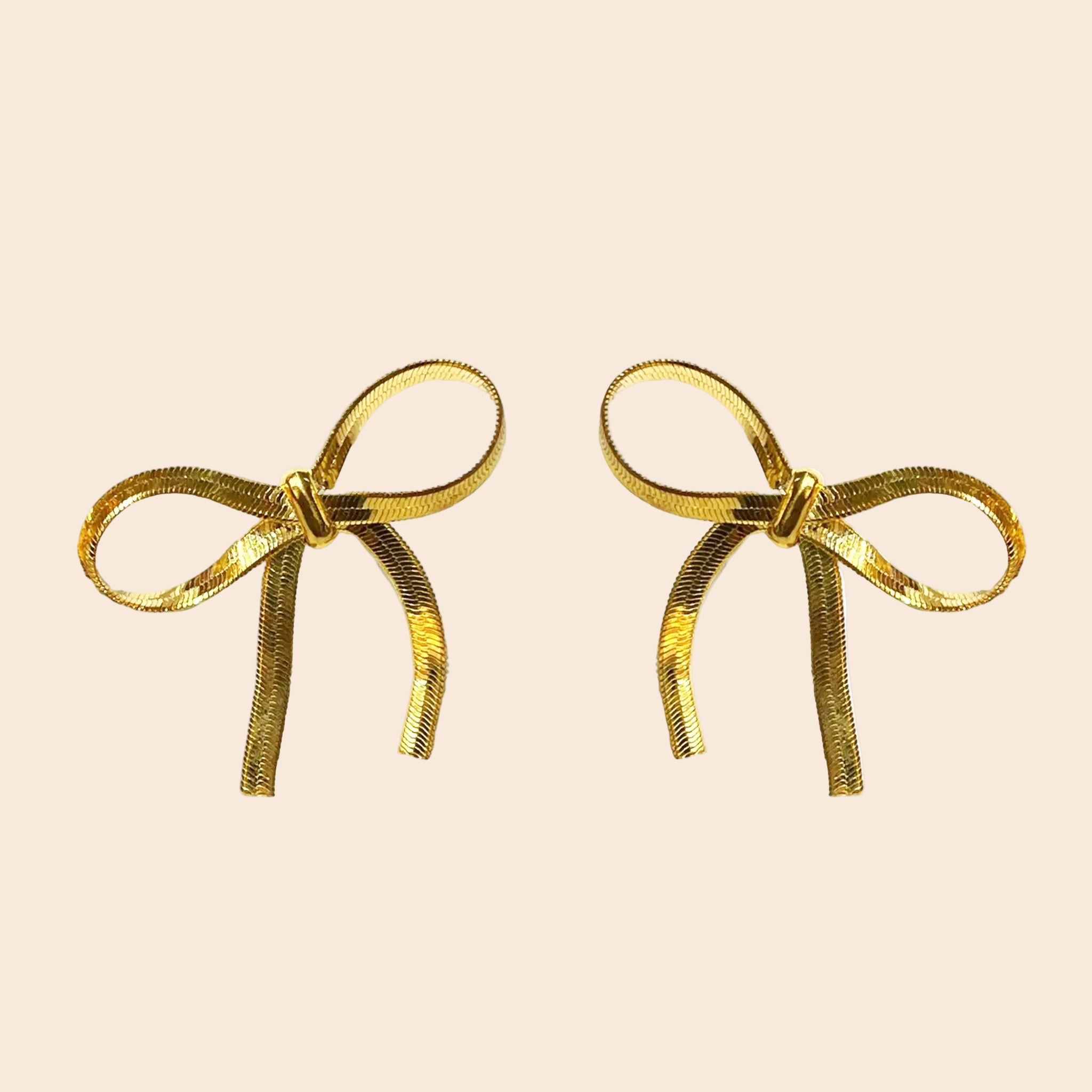 Gold bow shaped earrings. 