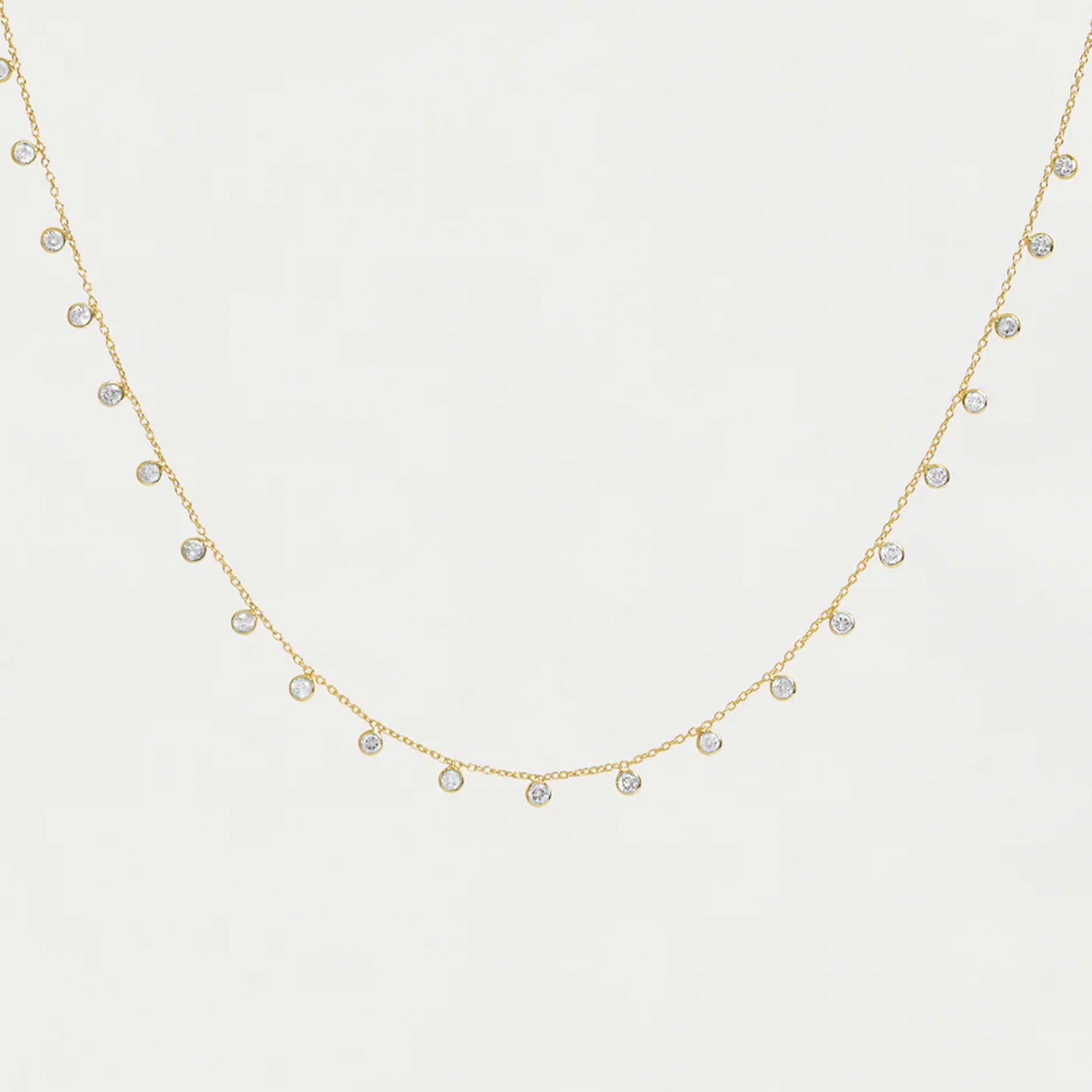 A chain necklace with round cz charms. 