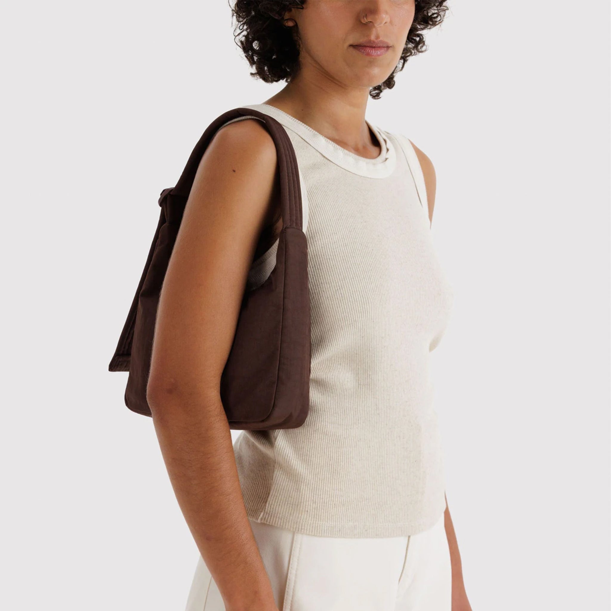 A dark brown nylon shoulder bag