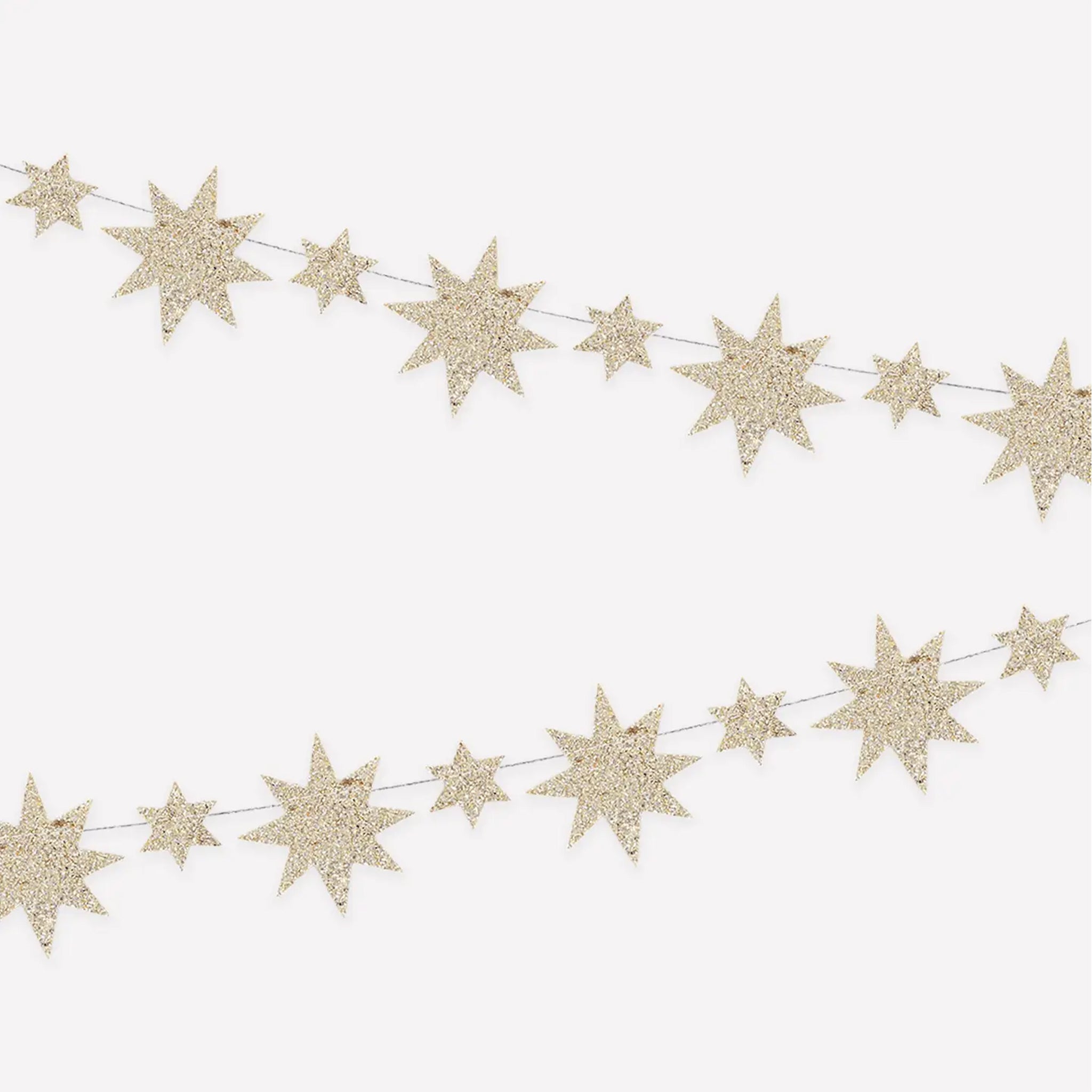A garland in the shape of gold glitter stars that are two different shapes. 