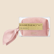 A dusty rose velvet mini emergency kit filled with 21 wedding day essentials. 