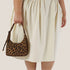 A brown and black leopard print mini shoulder bag. 