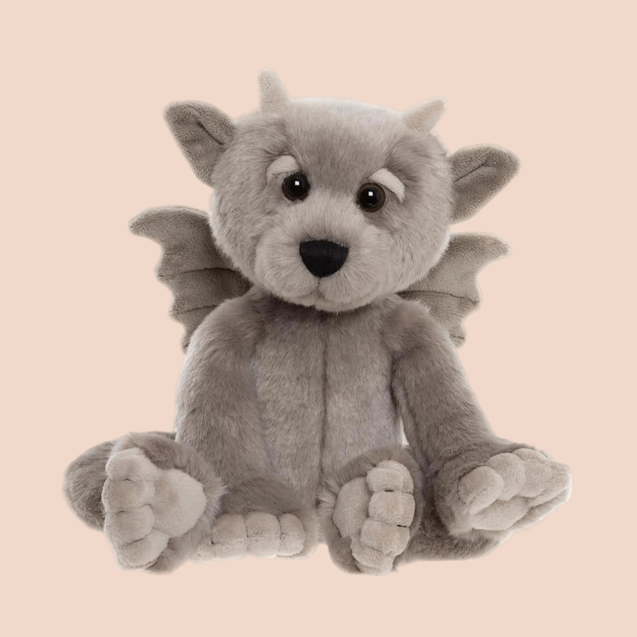 A grey mythical stuffed animal toy. 