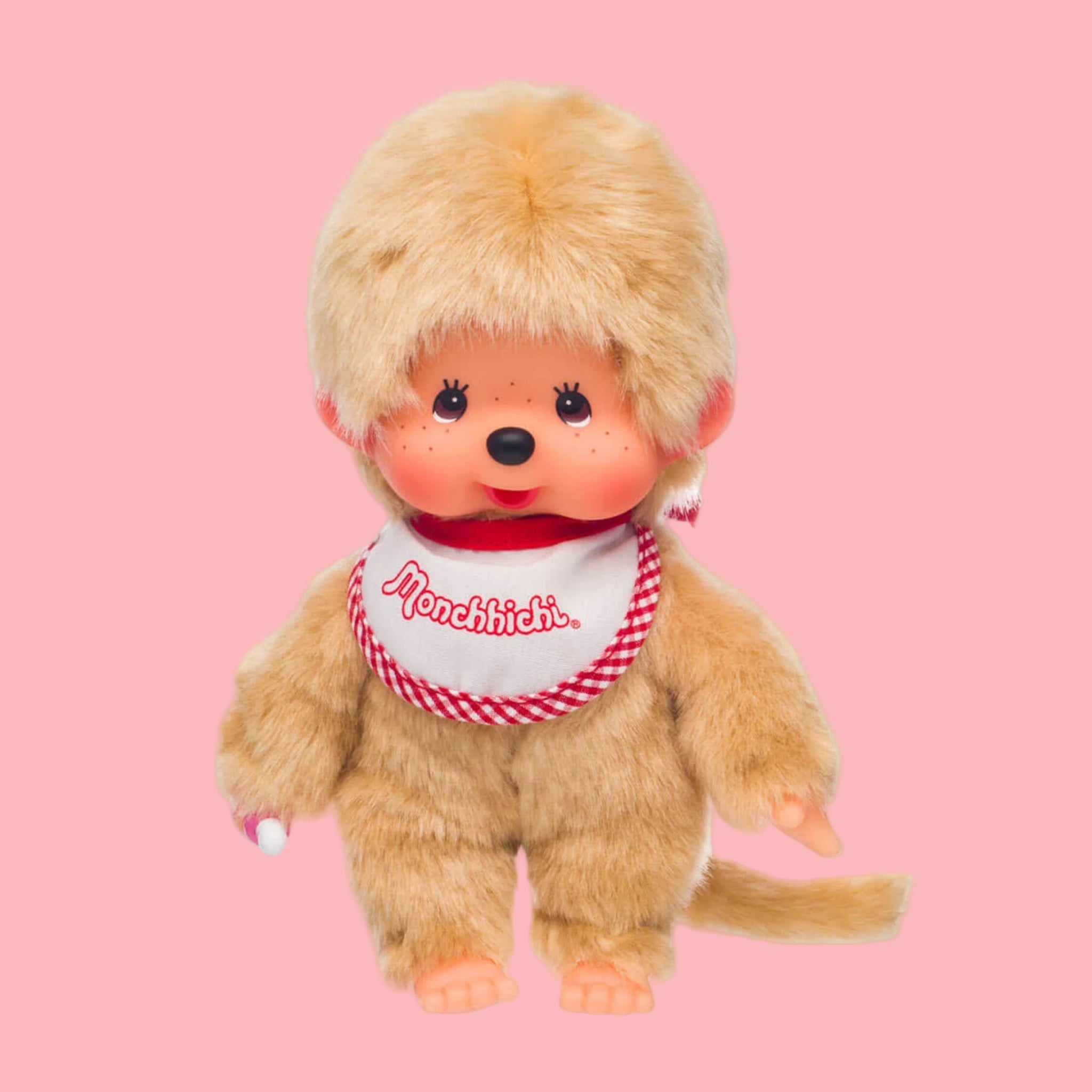 A tan Monchhichi doll.