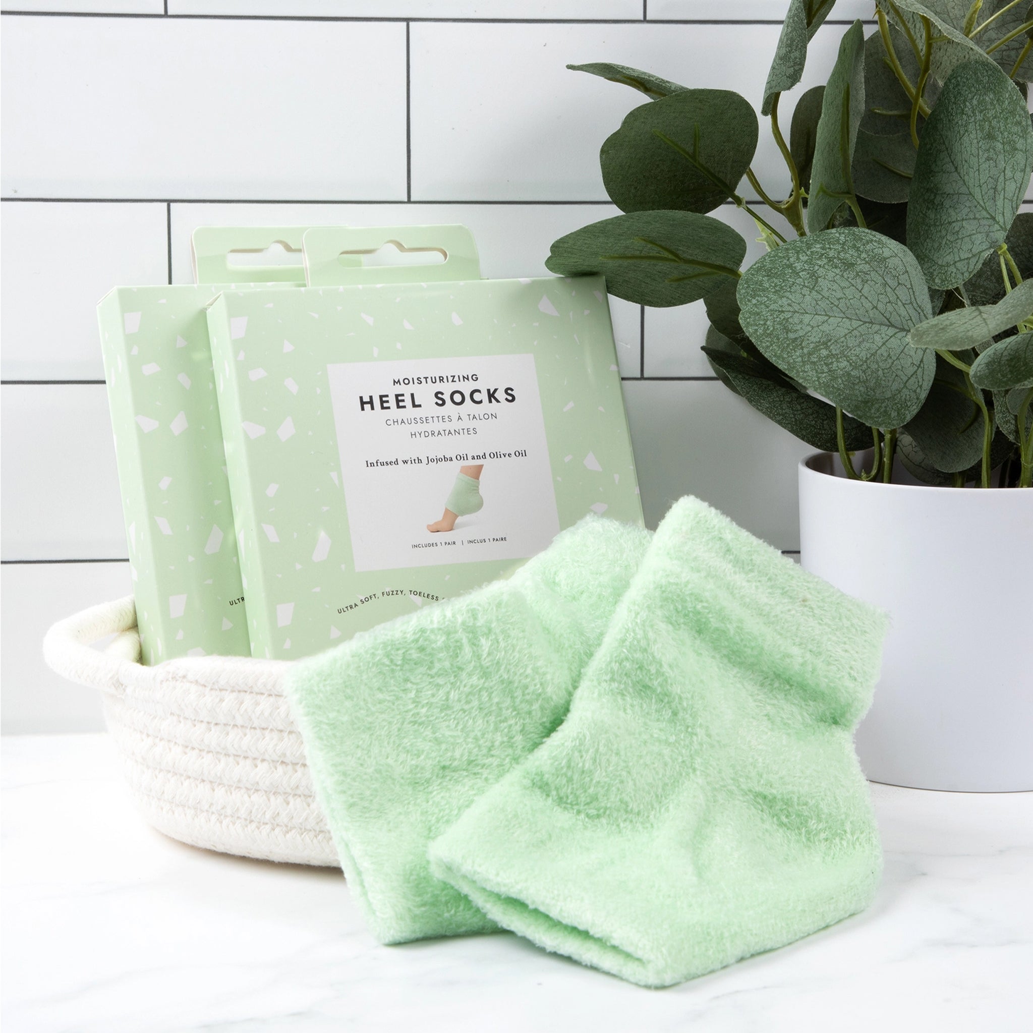 A green pair of moisturizing heel socks, "Moisturizing Heel Socks". 