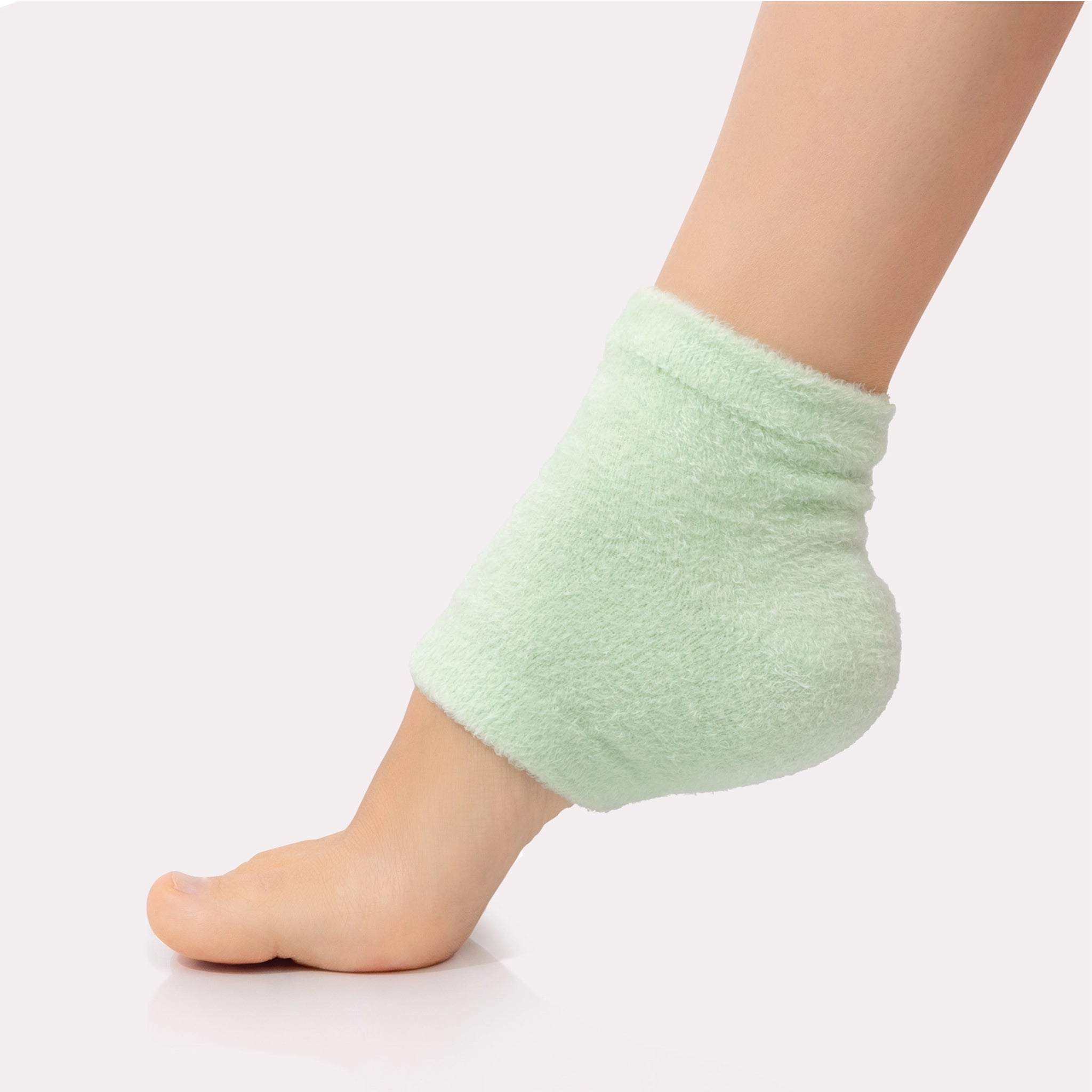 A green pair of moisturizing heel socks, "Moisturizing Heel Socks". 
