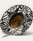 A black and ivory monster printed straw hat with a drawstring knot neck strap. 