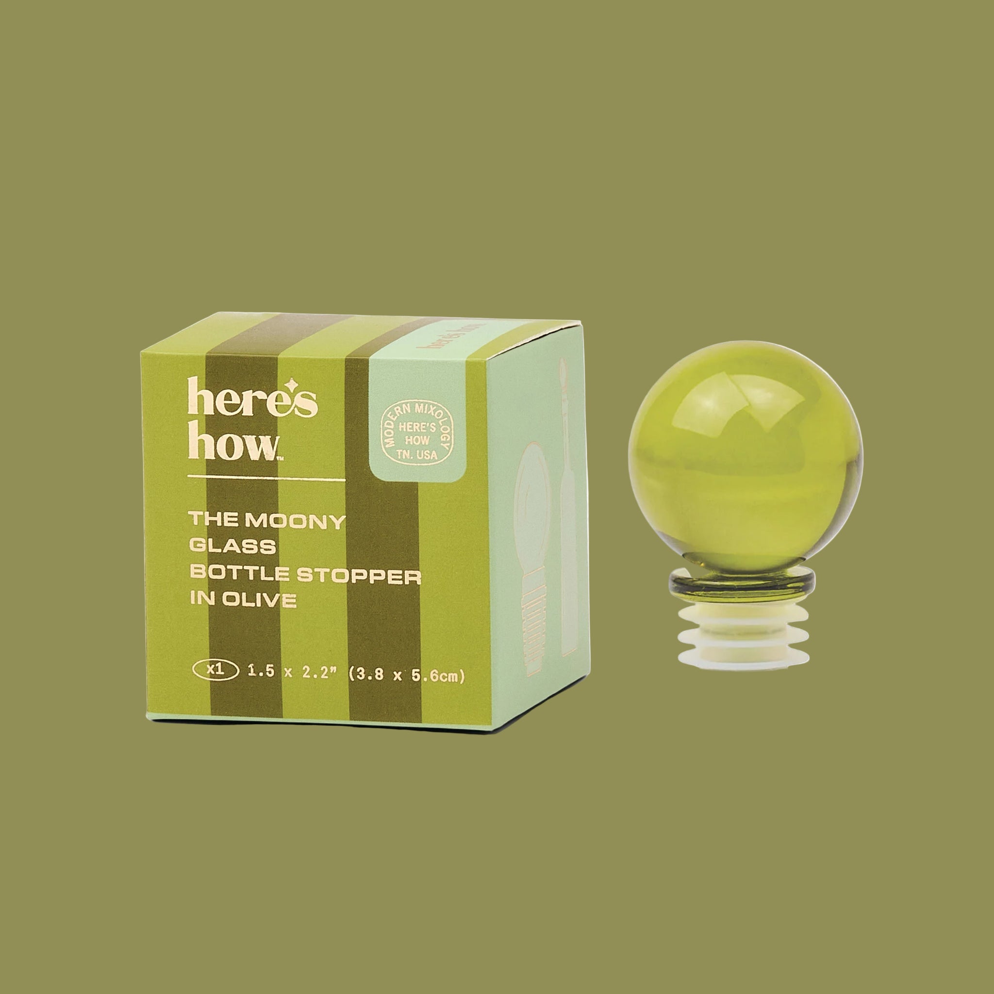 A olive green glass ball bottle stopper. 