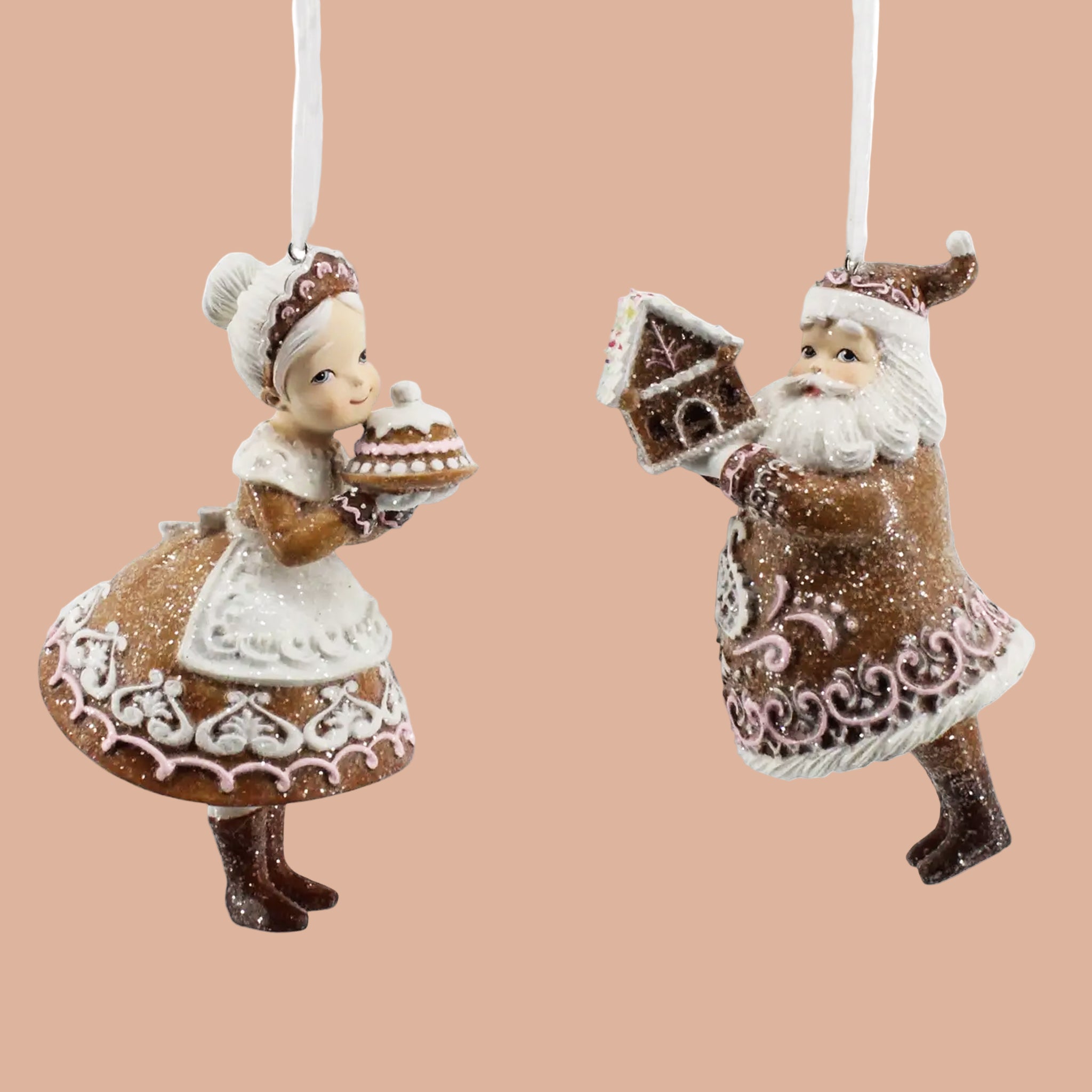A set of brown gingerbread Mr. and Mrs. Santa ornaments. 