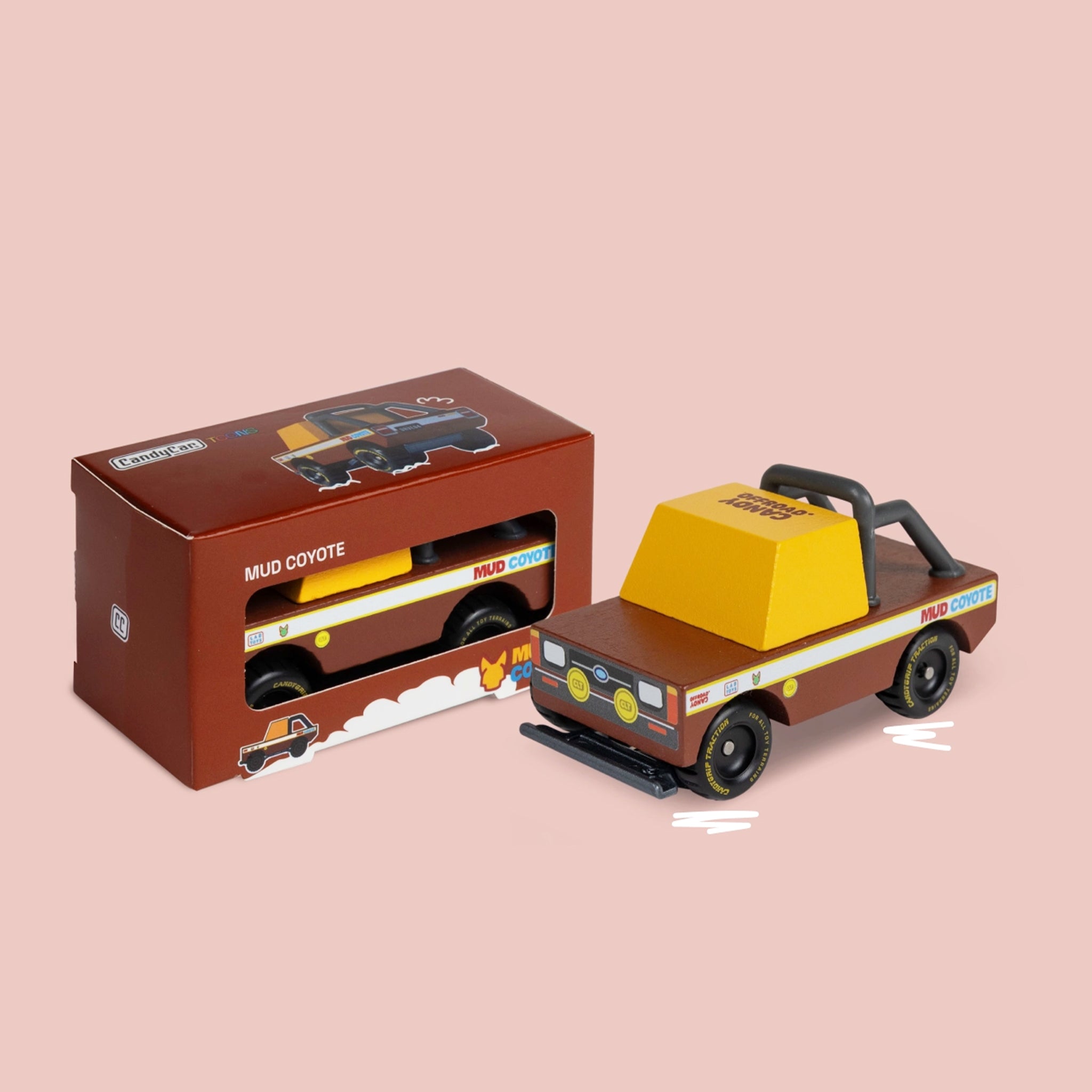A brown and yellow mud truck wooden toy. 