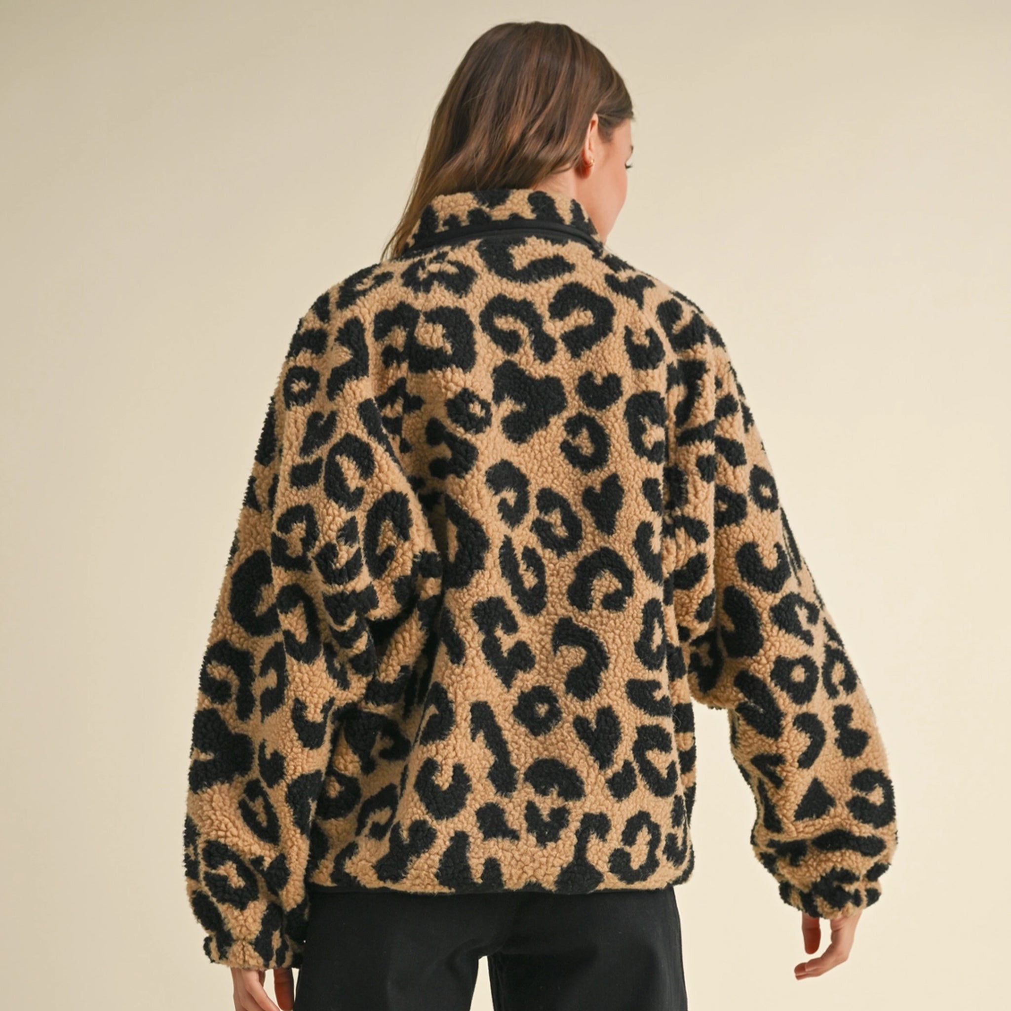 A black and brown leopard print sherpa print jacket. 