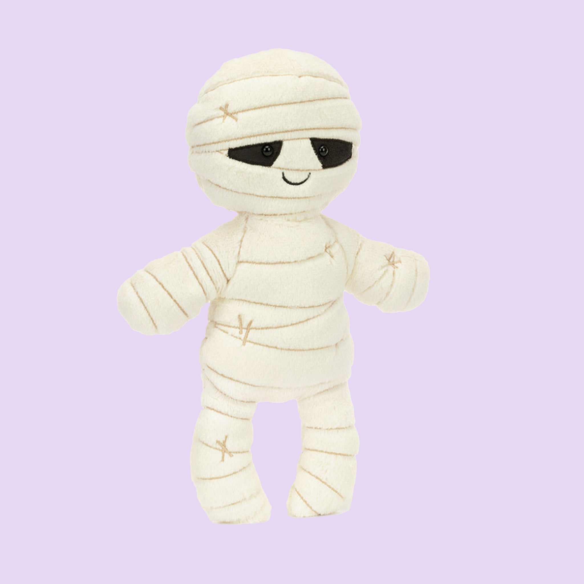 A mummy shaped stuffed toy. 