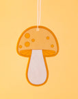 A yellow and orange mushroom shaped air freshener. 