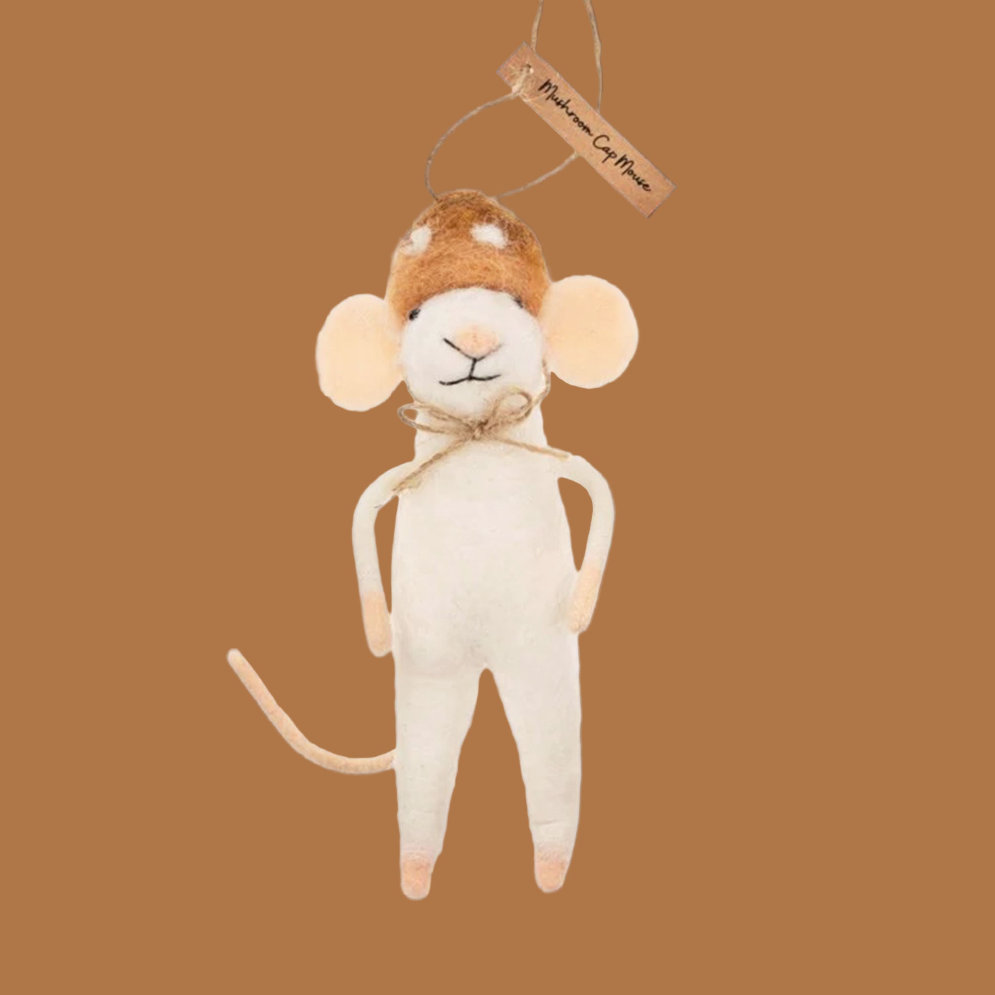 A white felt mouse ornament wearing a orange mushroom shaped hat. 