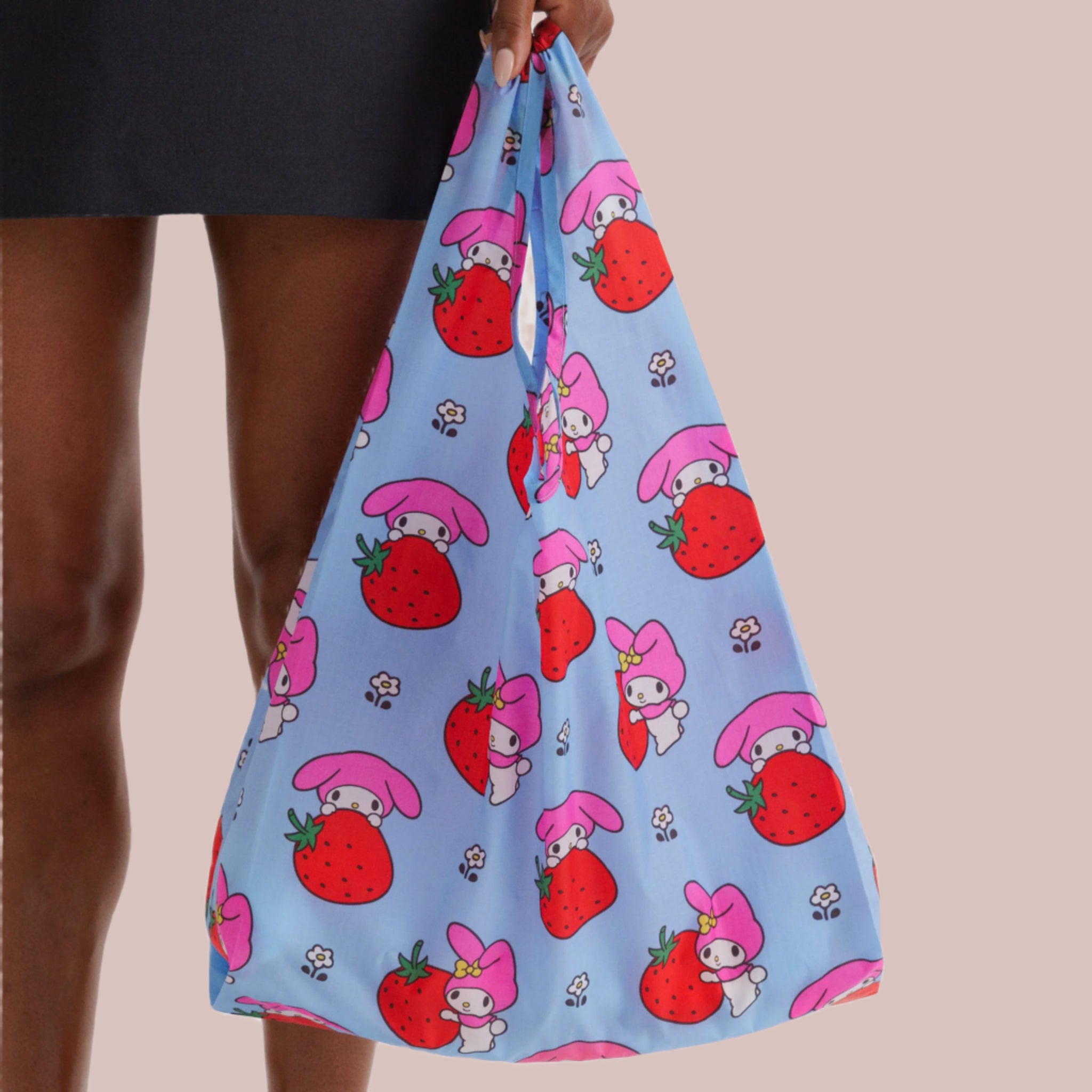 A blue nylon bag with a red and pink My Melody Strawberry print. 