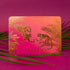 A pink and orange ombre card with gold foiled text and design of monkey's in jungle foliage cheersing champagne flutes and text that reads, "Cheers to the Newlyweds Congrats".