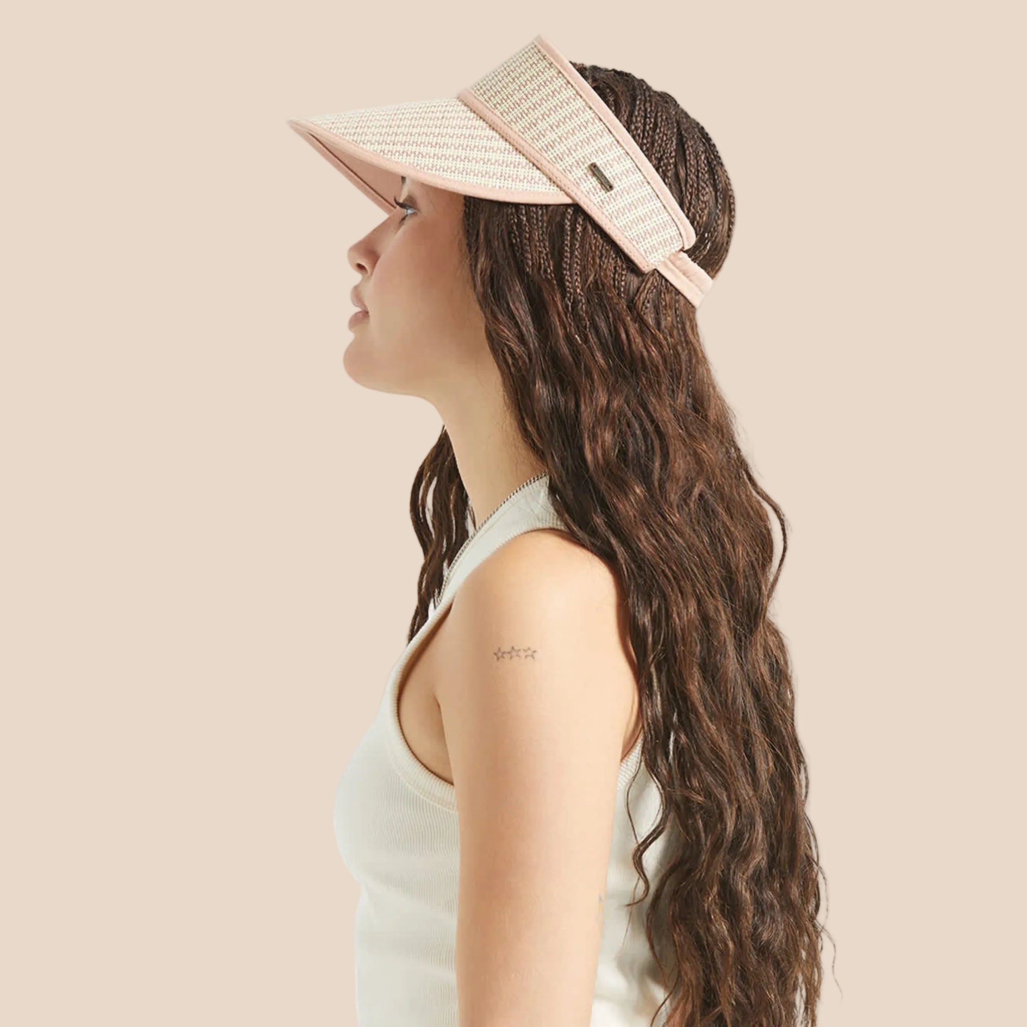 A straw and tan visor sun hat. 