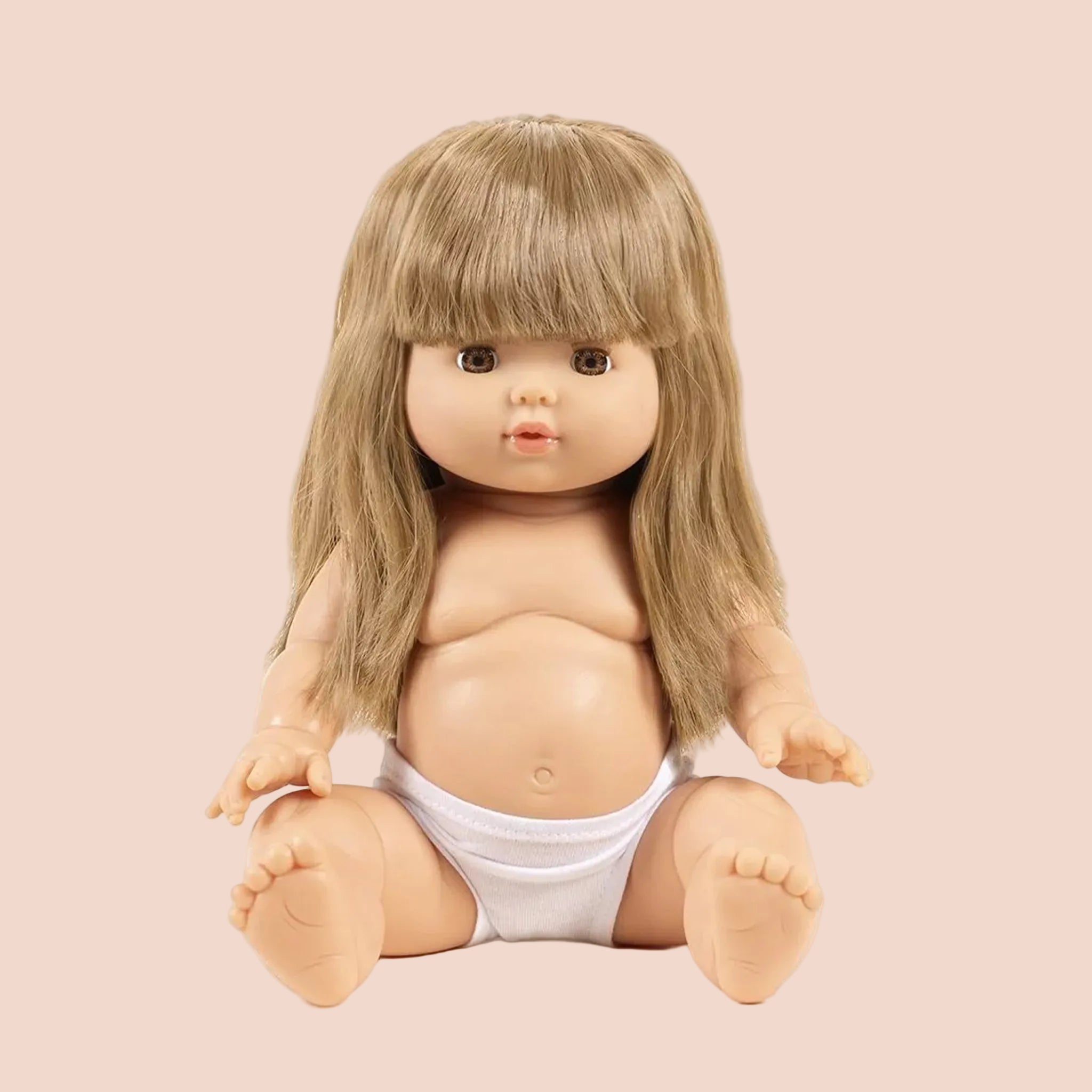 A baby doll with long blonde hair. 