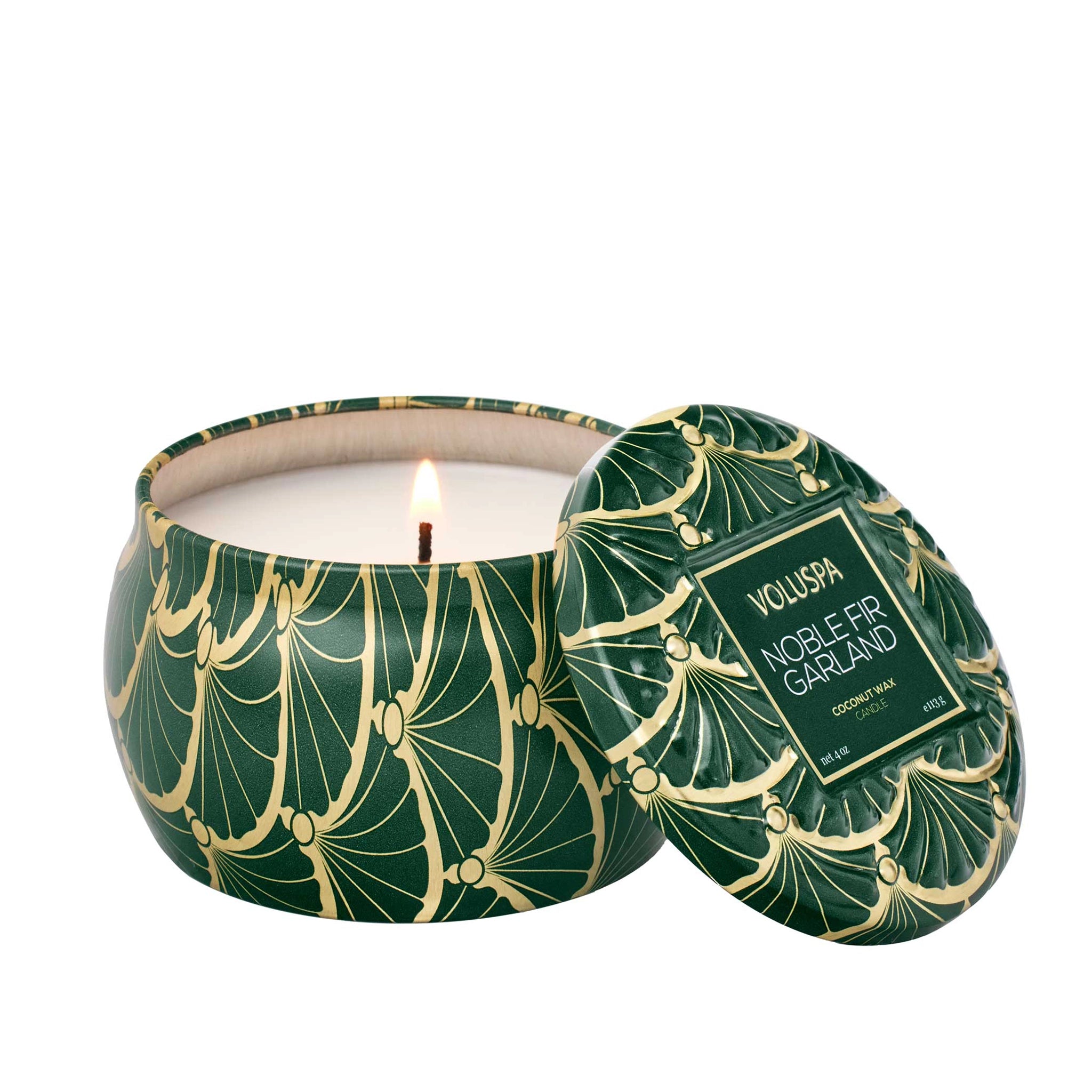 On a white background is a green and gold tin candle with white wax and a single wick as well as a label on the lid that reads, "Noble Fir Garland". 