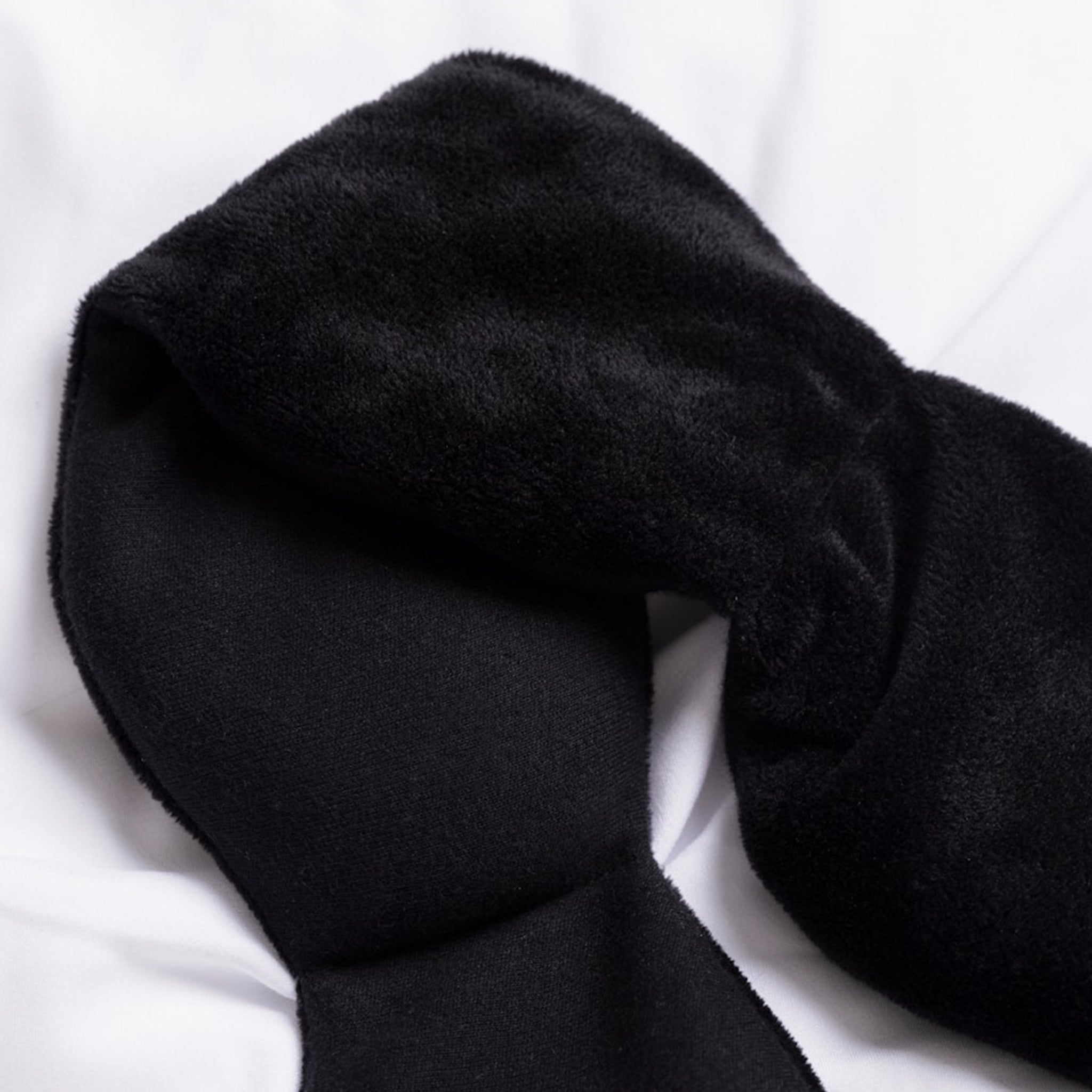 A black weighted eye mask. 