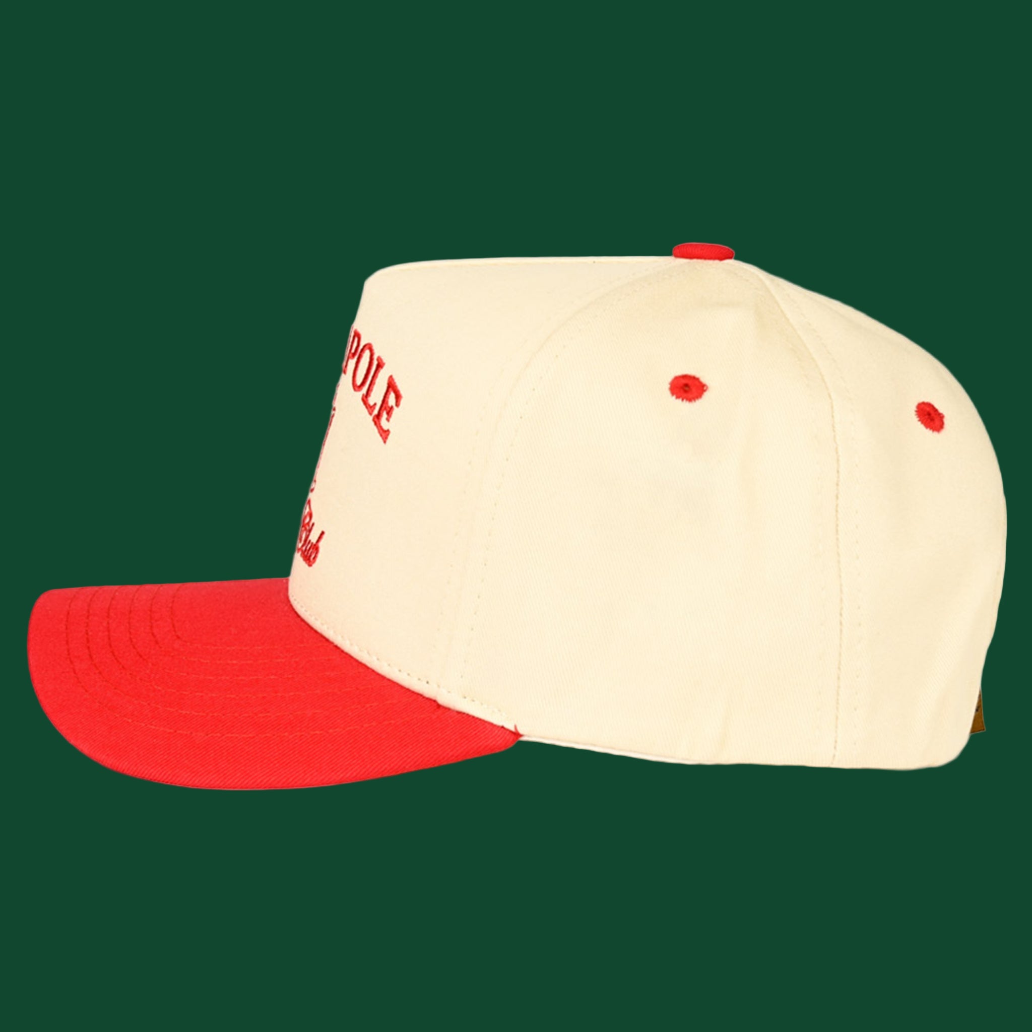 A cream and red trucker hat with embroidered text that reads, "North Pole Social Club". 