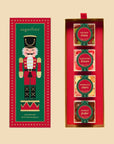 A box of four acrylic boxes of candy with a nutcracker graphic on top. 
