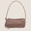A small loaf shaped nylon tote bag in a mauve color.