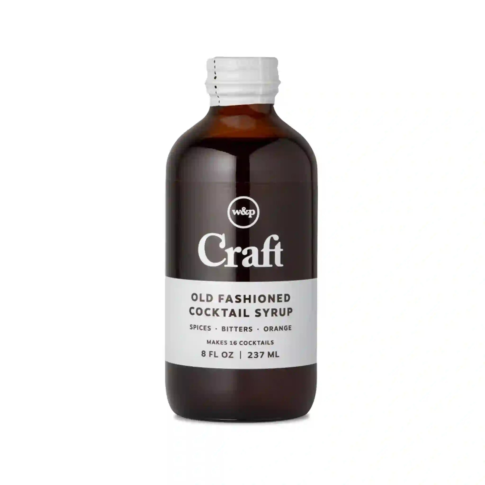 On a white background is a glass bottle of cocktail syrup.