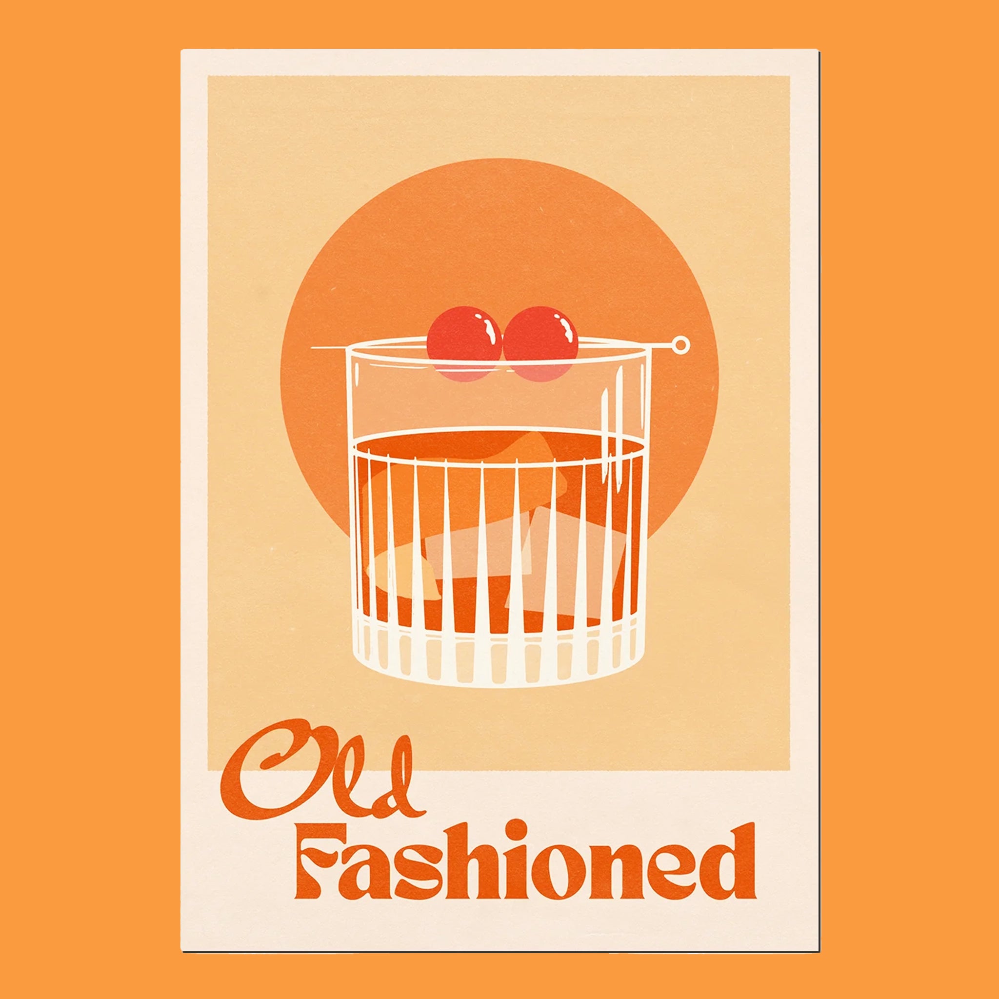 On an orange background is an orange art print with an ivory border and a graphic of an old fashioned cocktail and orange text that reads, &quot;Old Fashioned&quot;.