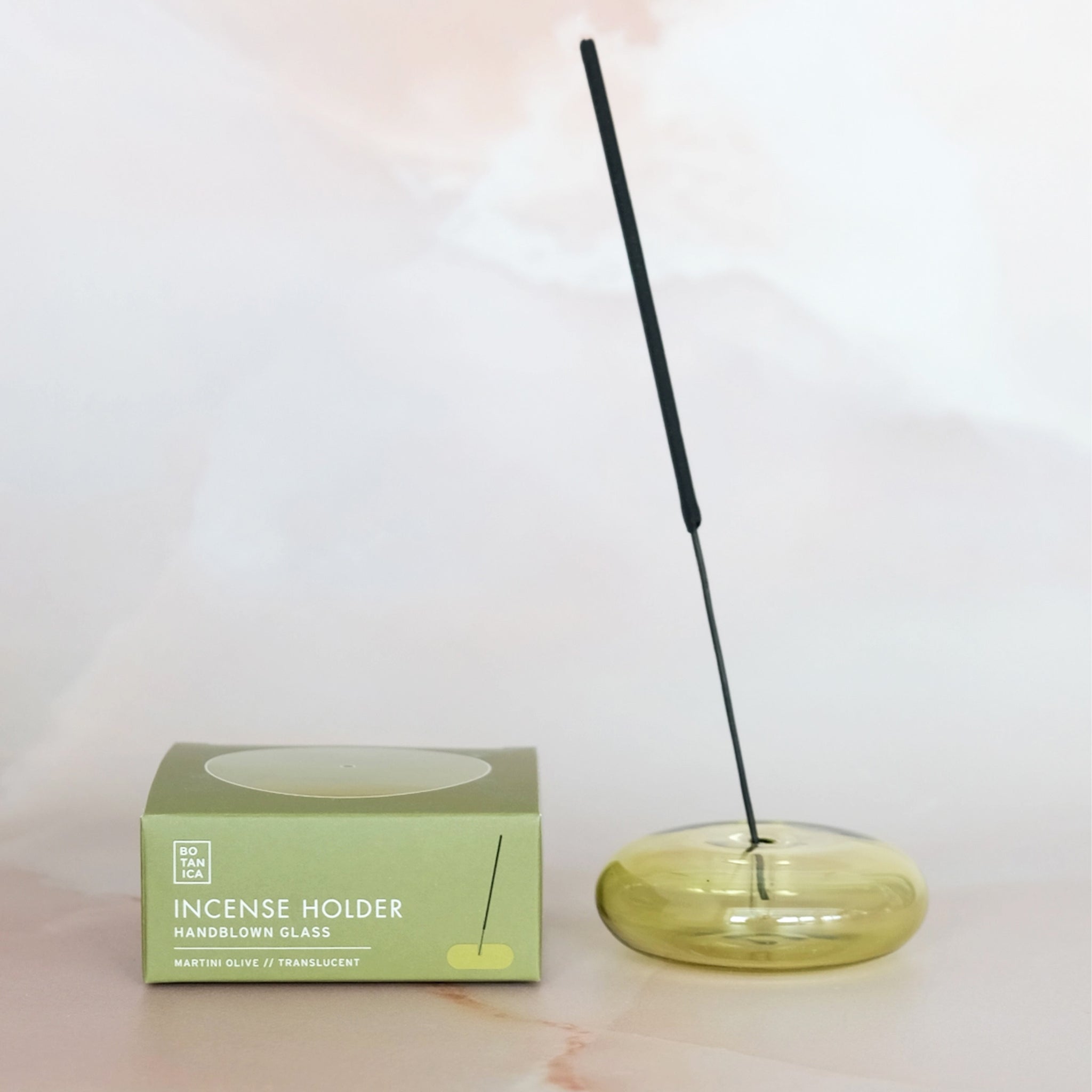A green bubble shaped incense holder. Incense not included.  