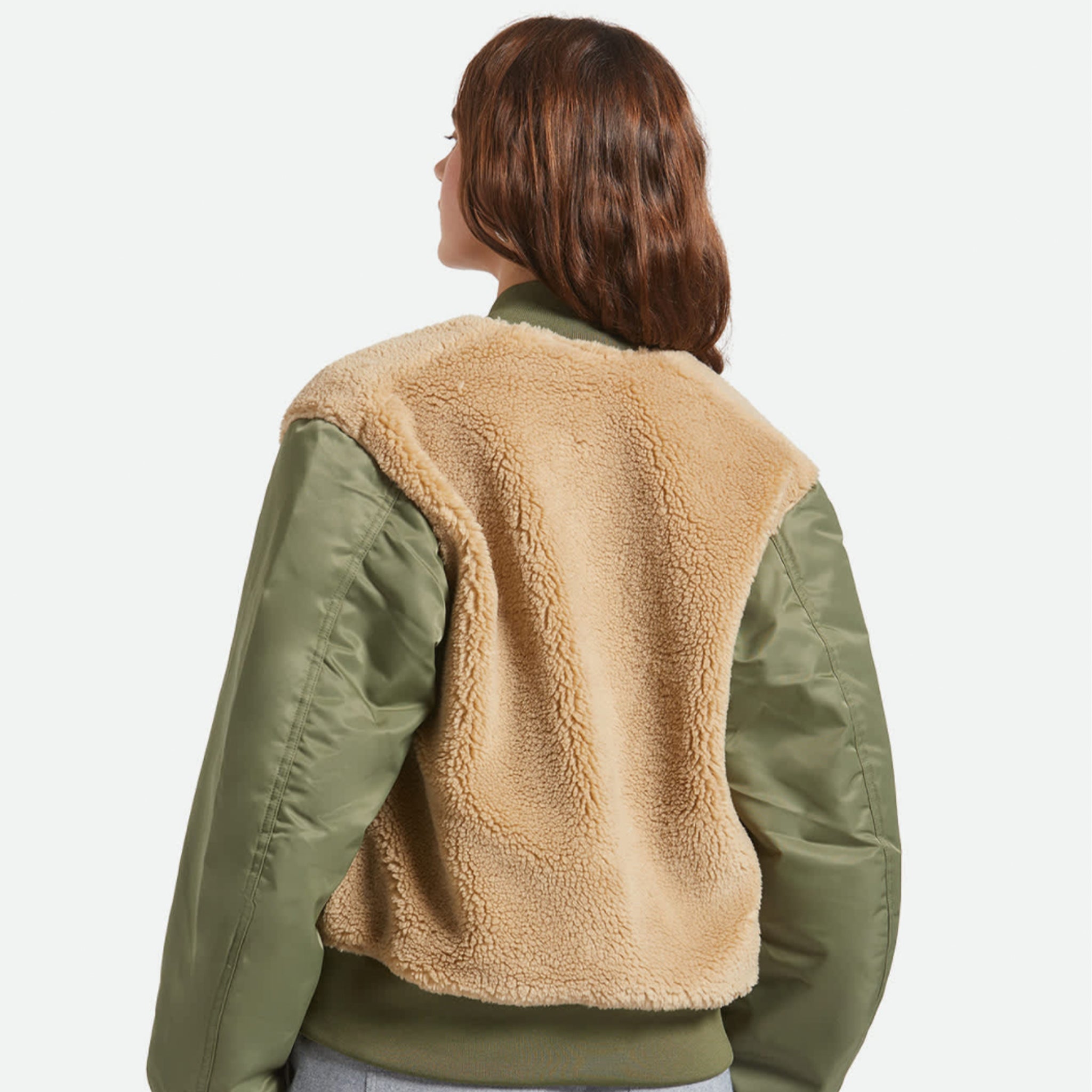 A green olive bomber jacket with a tan sherpa lining on the body and back of the jacket. 