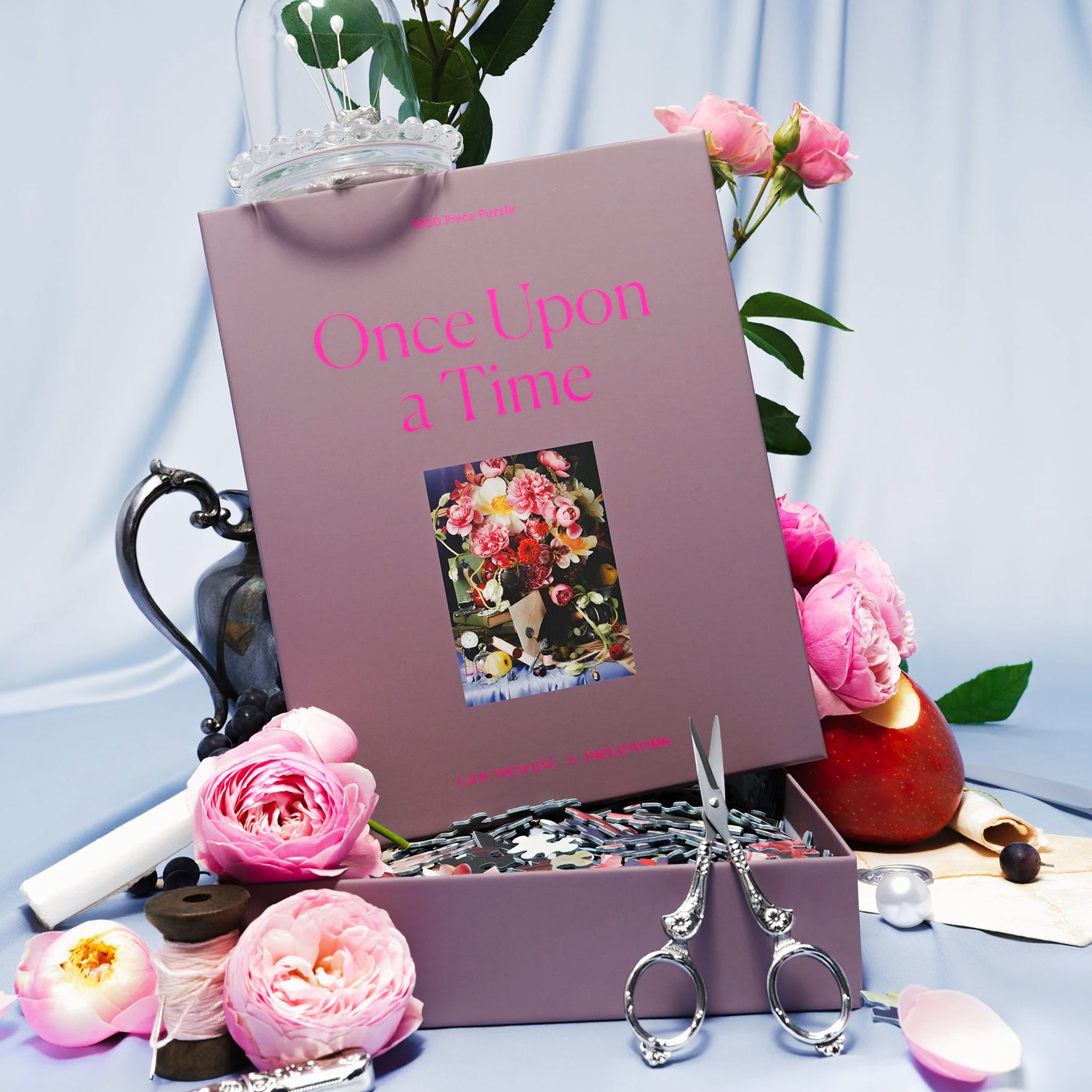 A purple boxed puzzle with a floral image and text that reads, "Once Upon A Time". 