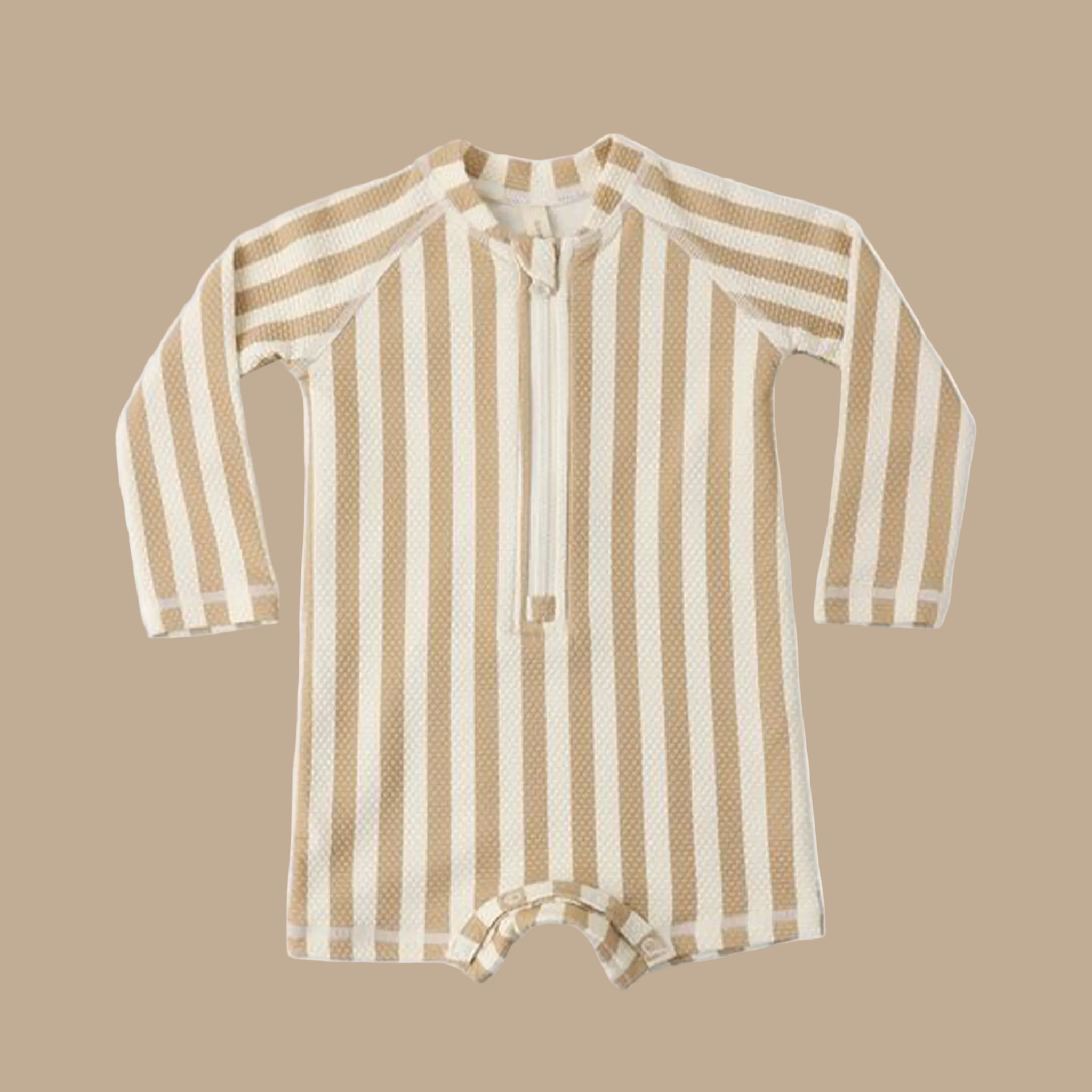 A cream and tan striped rashguard swimsuit for kids. 