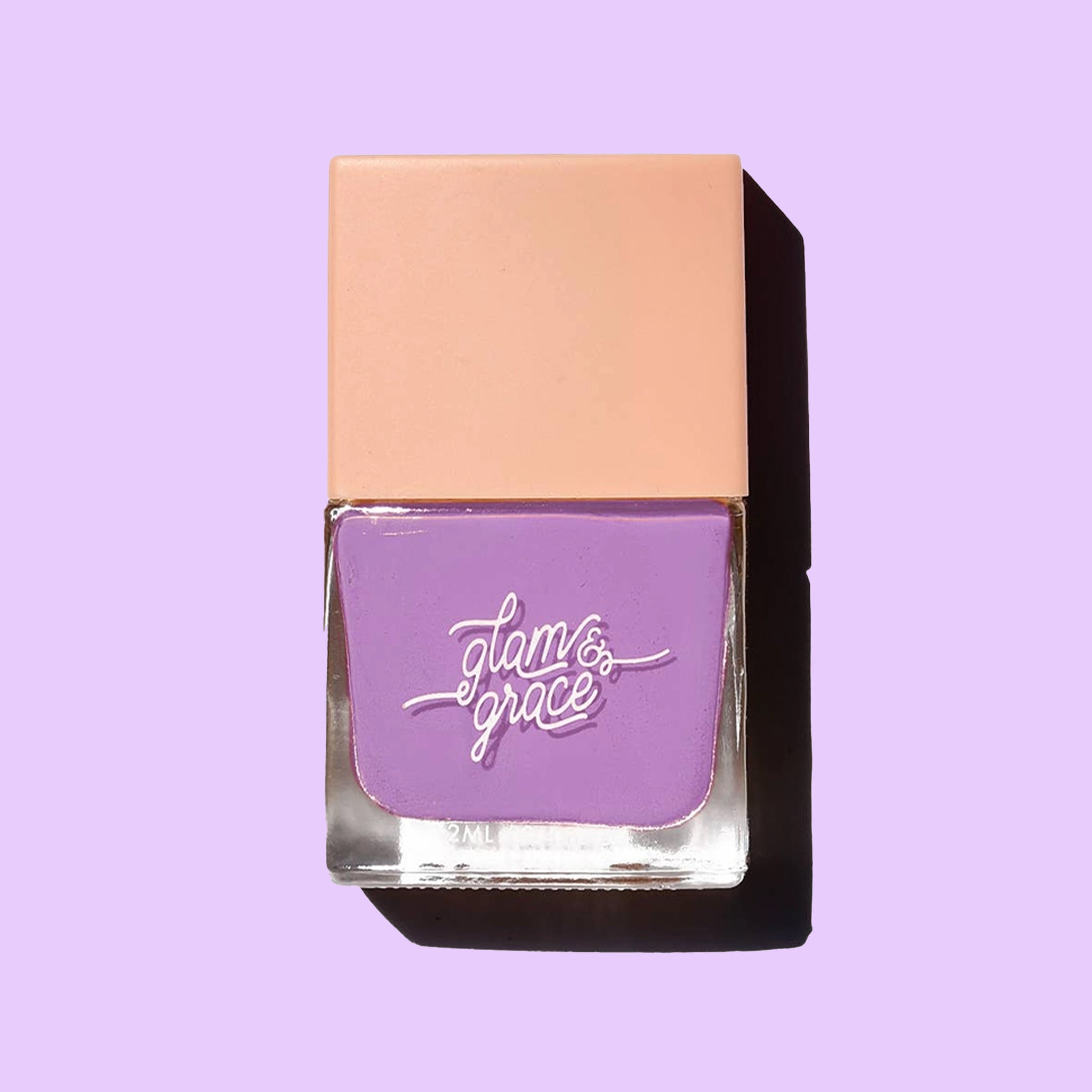 A bright purple satin nail polish in a glass bottle with a peachy square lid.