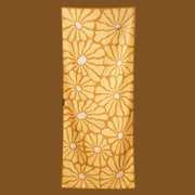 A yellow floral print towel.