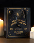 A black gift bag with gold ouija board design and black handles. 