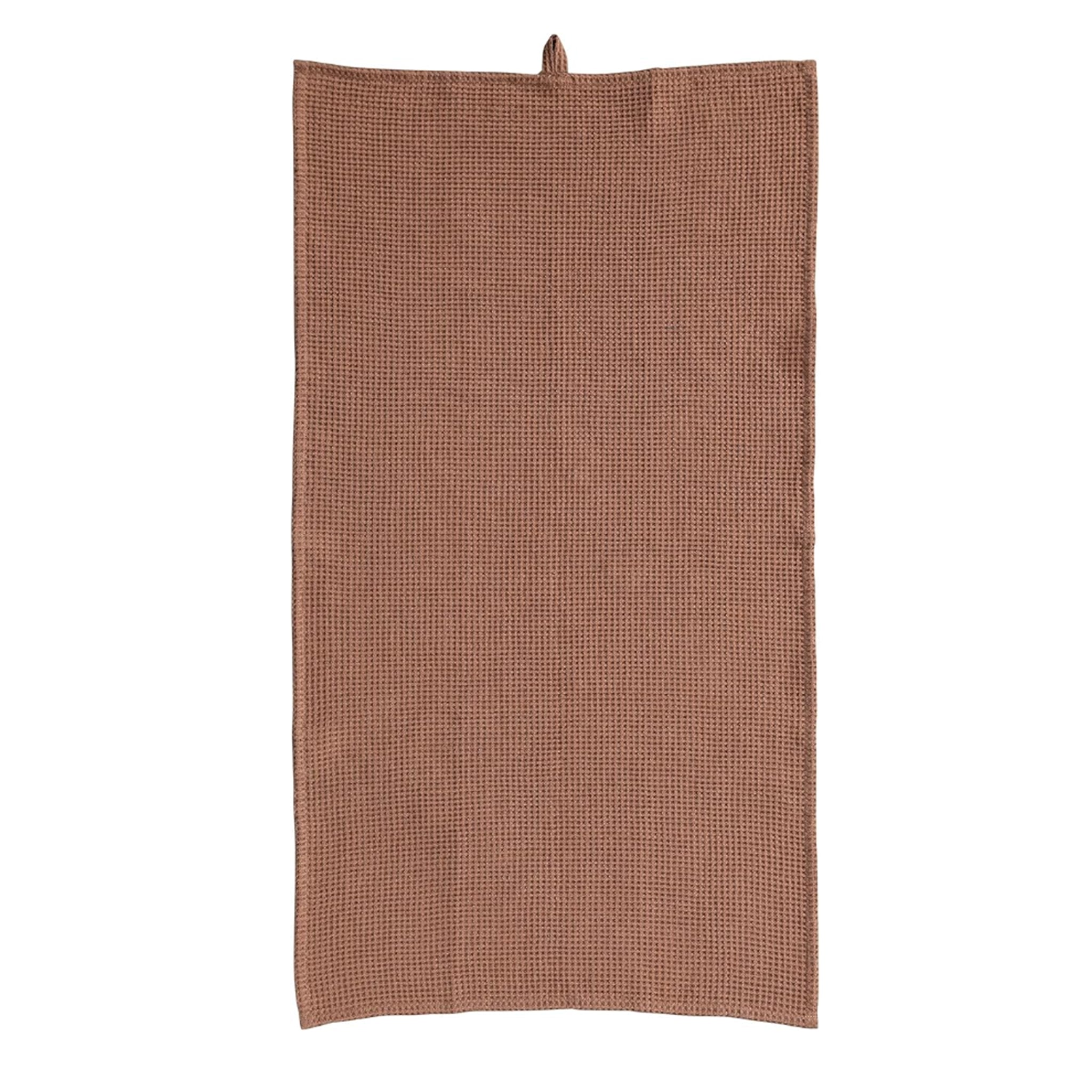On a white background is a terracotta colored waffle knit kitchen towel with a loop at the top for convenient hanging. 