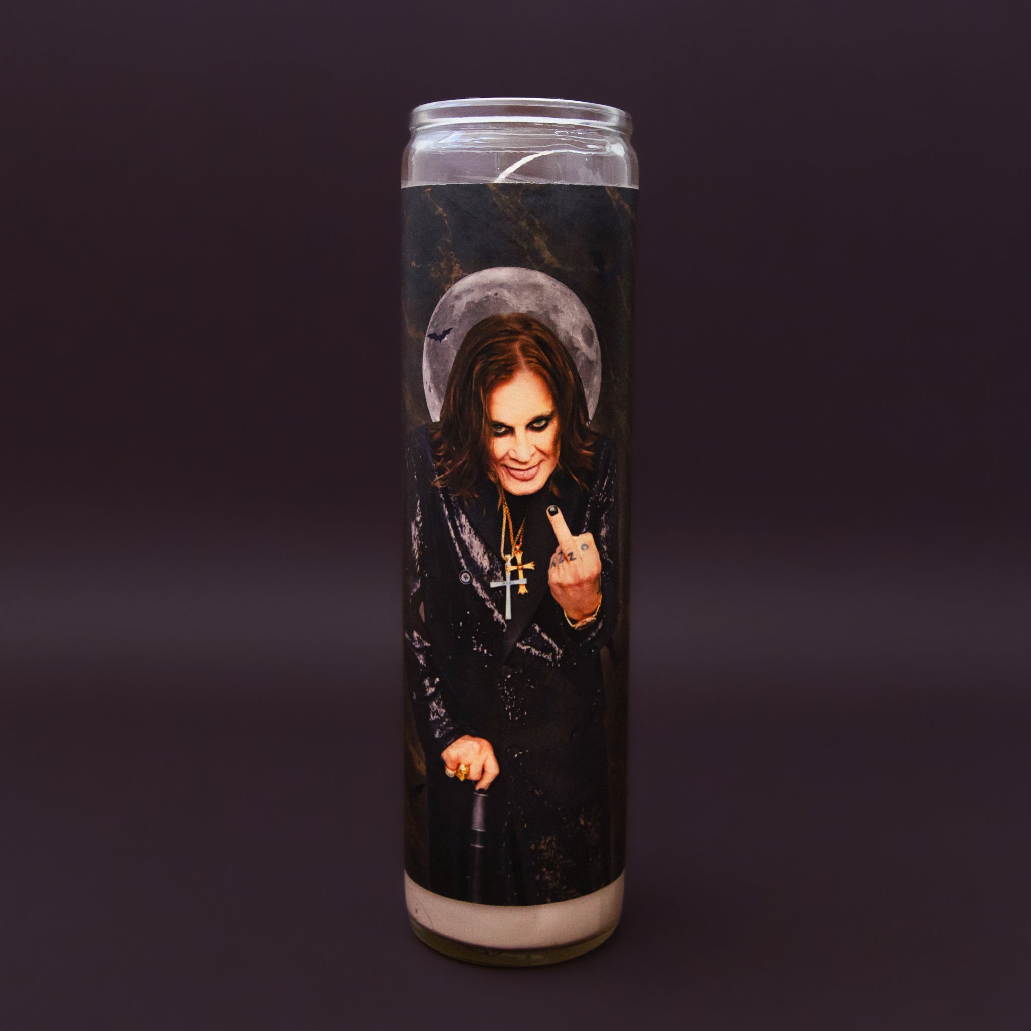 A prayer candle with a photo of Ozzy Osborn. 