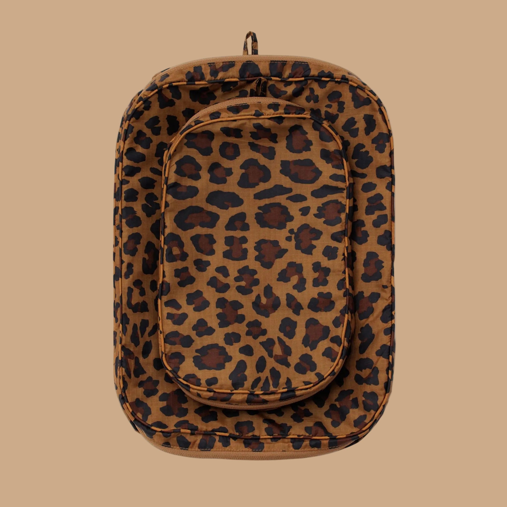 A brown and black leopard print packing cube set. 