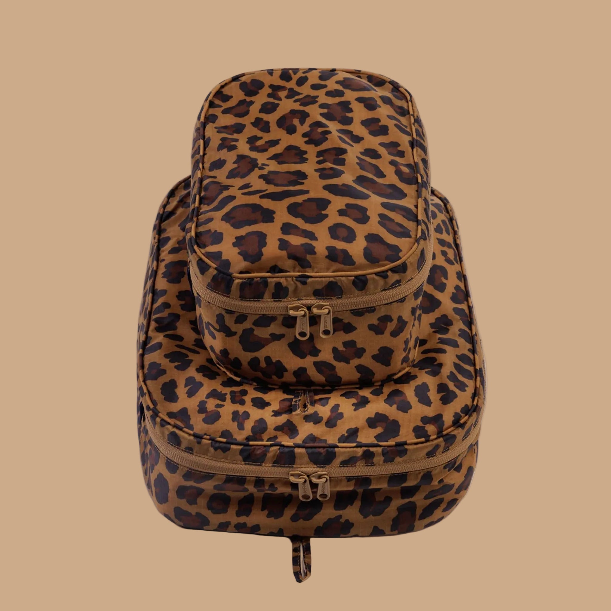 A brown and black leopard print packing cube set. 